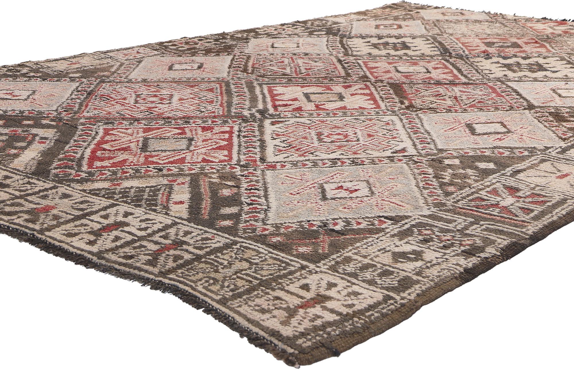 20856 Vintage Beni MGuild Moroccan Rug, 05'10 x 08'09. 
This hand-knotted wool vintage Beni M'Guild Moroccan rug features an all-over diamond lattice pattern spread across the abrashed field. The double lines composed of arrows crisscross