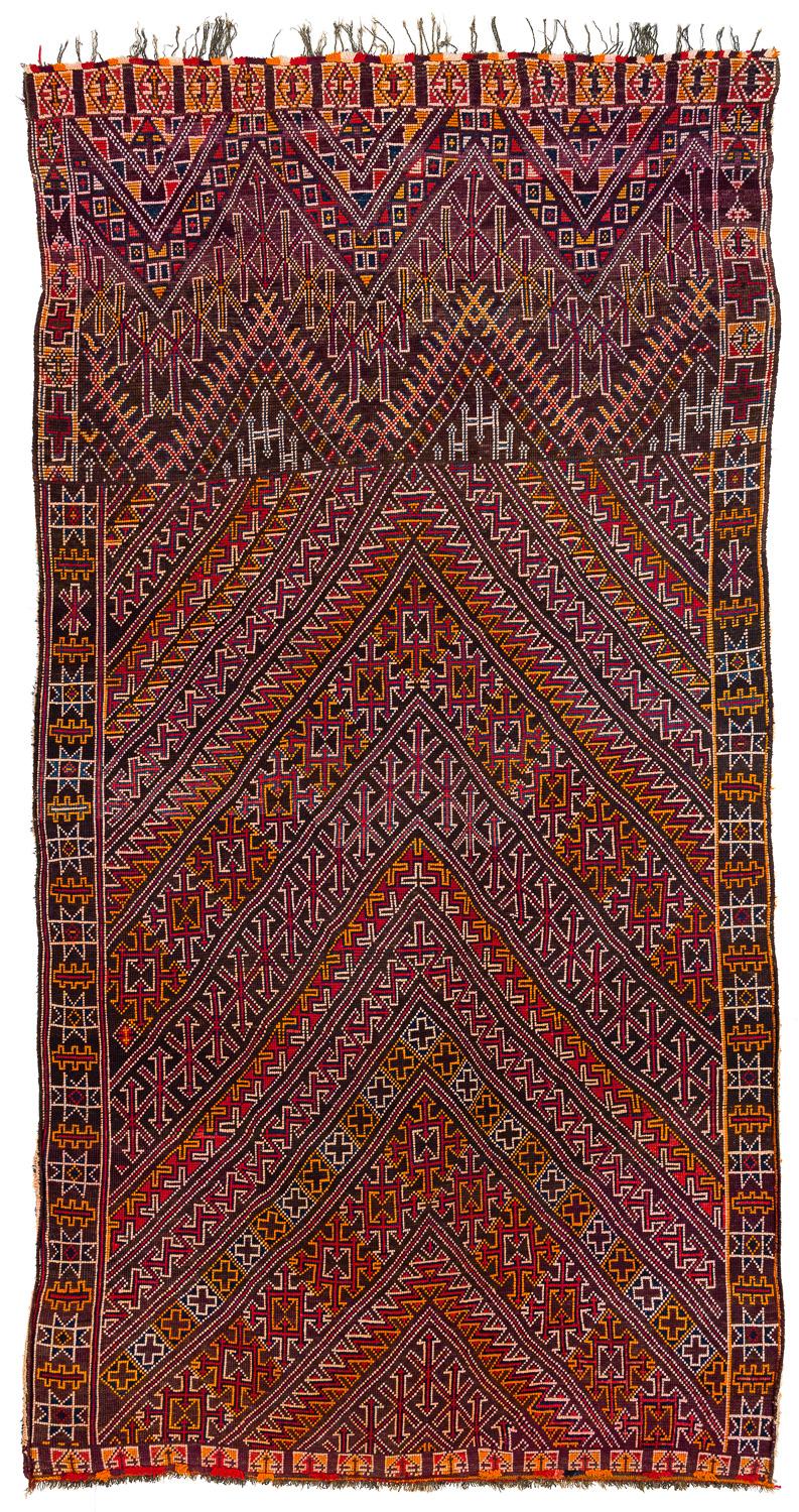 This Moroccan is in perfect condition, woven in good wool. A superb classical Beni Mguild with a quite mystic color range with deep purples and blues contrasted with red and orange.
  
