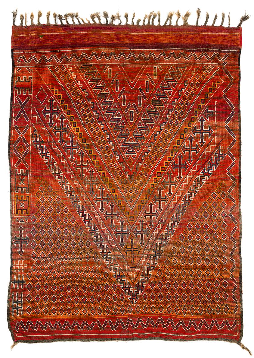 This vintage Moroccan rug is in perfect condition. It is woven with excellent and very lustrous wool in fiery reds and oranges and has an even and quite elegant surface. Another great classical Beni Mguild with real age and patina.
 