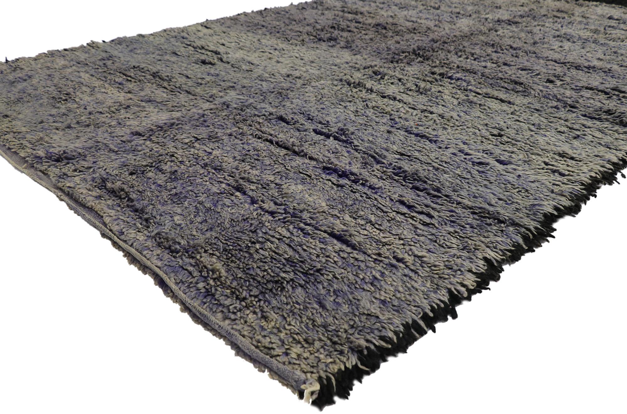 21314 Vintage Beni Mrirt Moroccan Rug, 06'02 x 10'03.
Nomadic charm meets Abstract Expressionism in this hand-knotted wool vintage Beni Mrirt Moroccan rug. Imbued with black and purple hues, the rich waves of abrash and softly gradated striations
