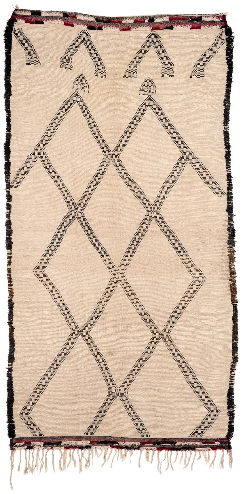 It appears that this rug had a false start in the design, or perhaps it was intentional, whatever the case, it is intriguing. Made with fantastic lustrous hand spun wool from the high Atlas mountains of Morocco. Measures: 6'1