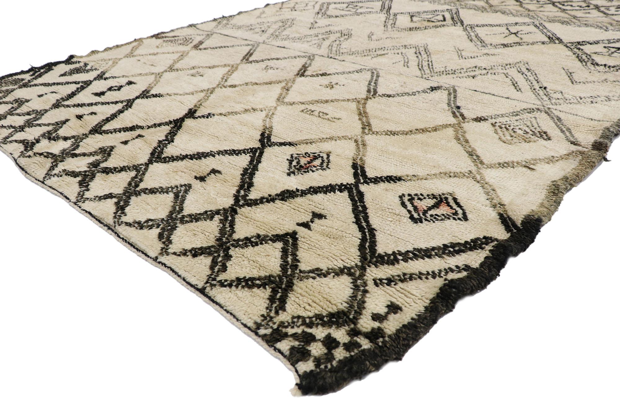 21370 Vintage Berber Moroccan Beni Ourain Rug, 06'04 x 09'09.
With its simplicity, plush pile and tribal style, this hand knotted wool vintage Berber Beni Ourain Moroccan rug is a captivating vision of woven beauty. It features variations of a