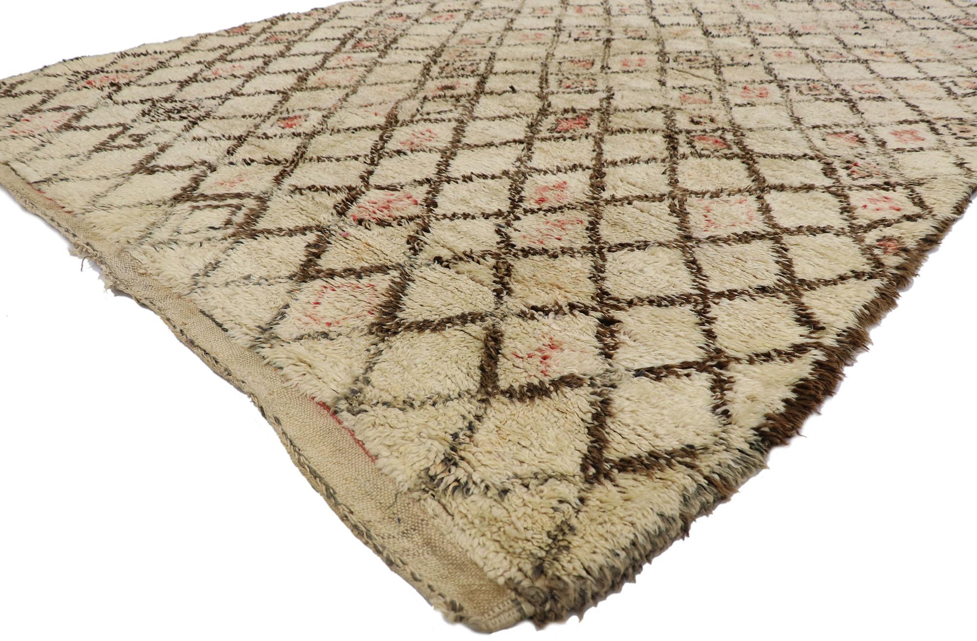 21359 Vintage Moroccan Beni Ourain Rug, 06'01 x 09'03.
Emulating nomadic charm with incredible detail and texture, this hand knotted wool vintage Beni Ourain Moroccan rug is a captivating vision of woven beauty. The detailed diamond trellis and