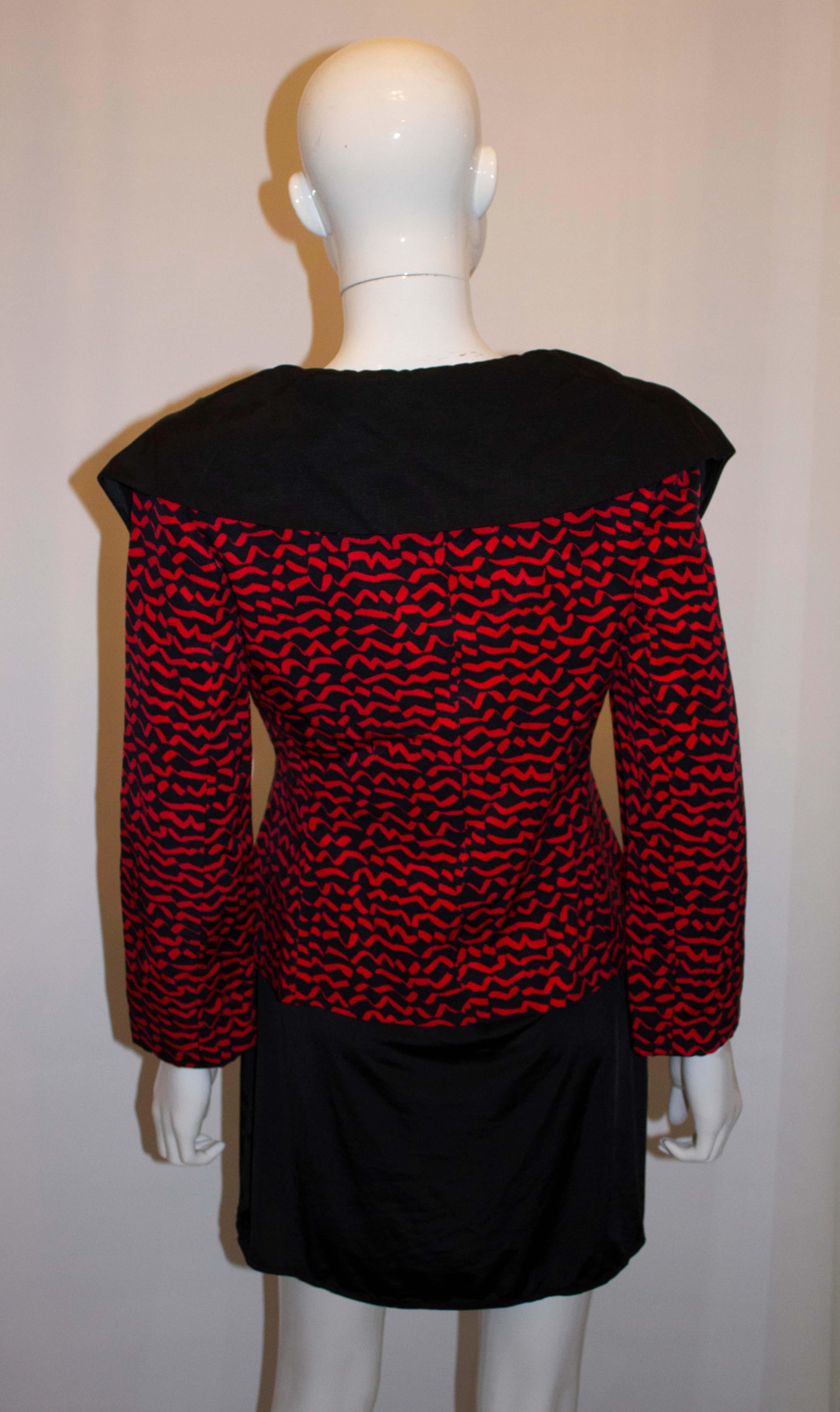 A fun vintage jacket by Benny Ong. The jacket is in a red and black mix with a wide black collar and re ribbon  detail. It is lined with a three button front fastening. 
Measurements: Bust 36'', length 23''