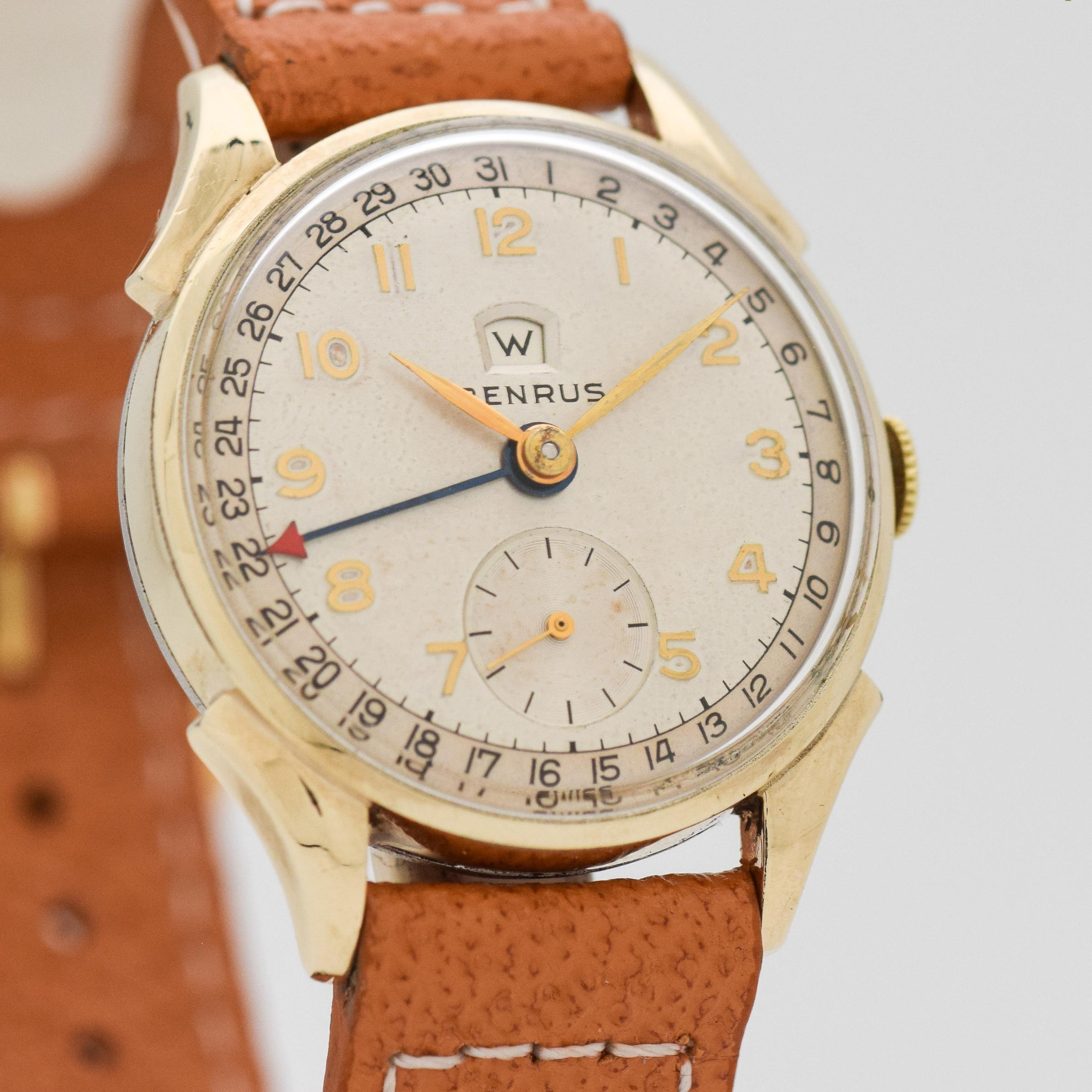 1950's Vintage Benrus Day-Date Ref. CE 13 10k Yellow Gold Plated watch with Original Silver Dial with Applied Gold Color Arabic Numbers. 30mm x 36mm lug to lug (1.18 in. x 1.42 in.) - 17 jewel, manual caliber ETA movement. Equipped with a Leather