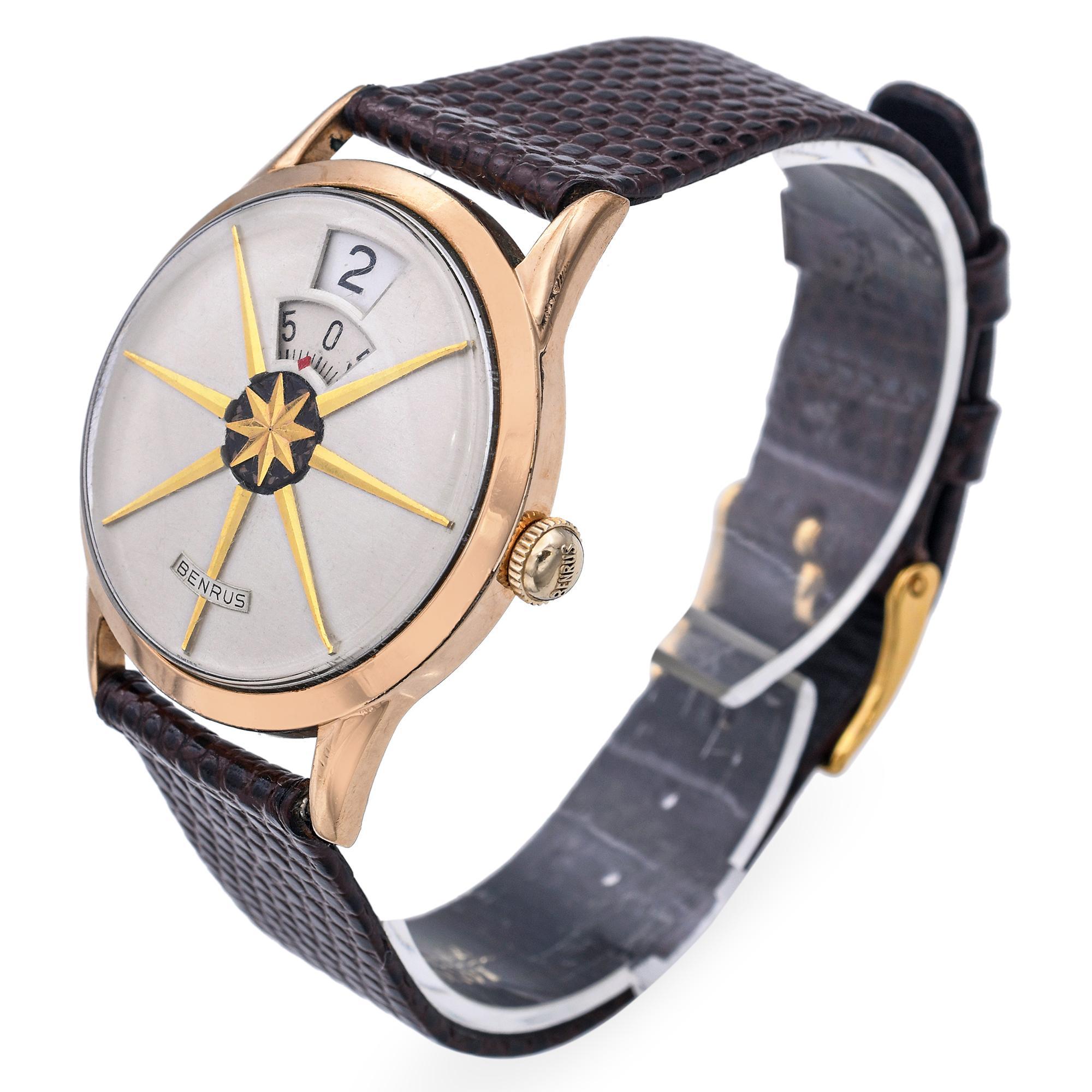 This striking vintage Benrus Dial-O-Rama jump hour watch is a standout piece of mid-century design and mechanical ingenuity. Featuring a unique digital-style display, the hour and minutes are revealed through rotating discs in separate windows,