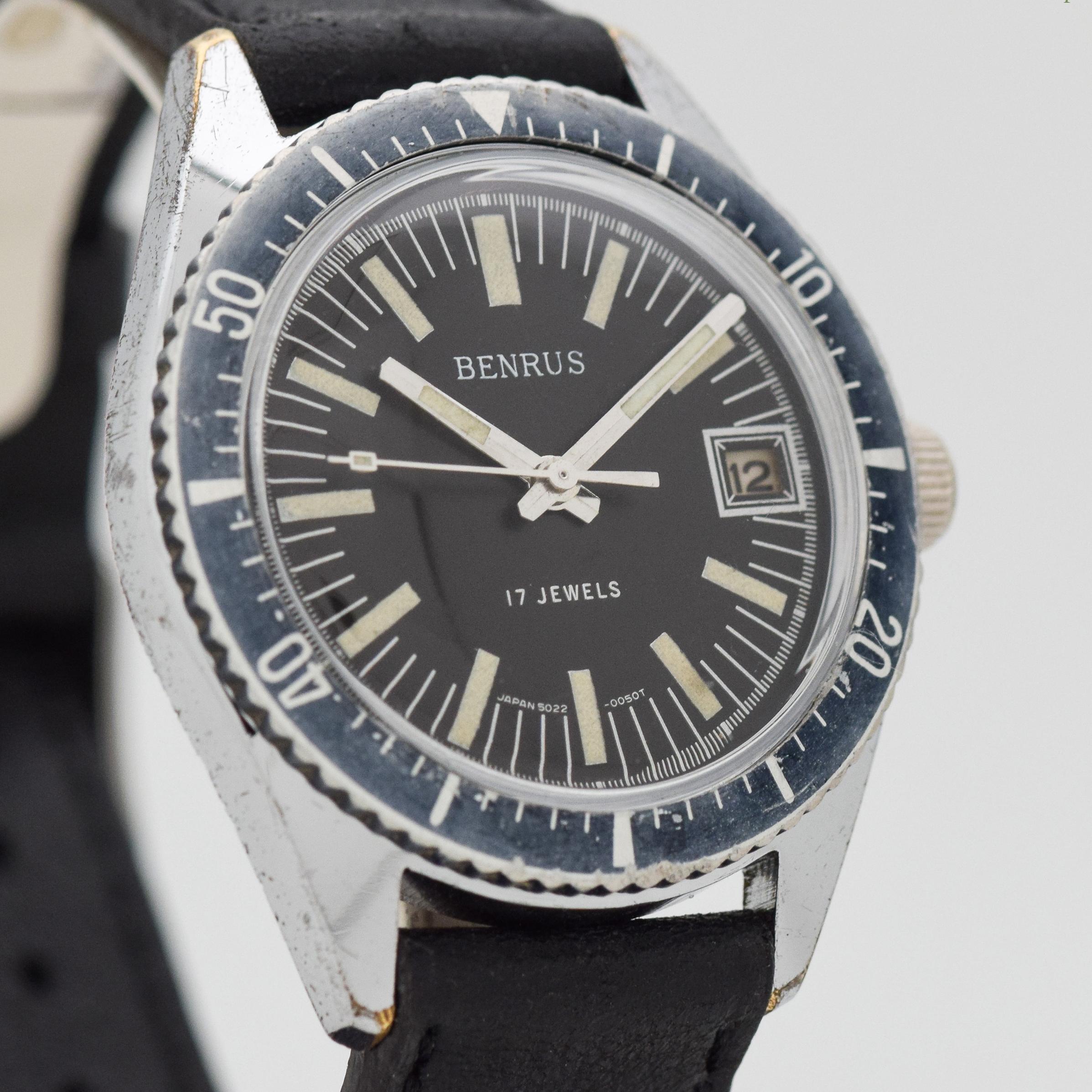 1970's Vintage Benrus Divers Watch. Base Metal & Stainless Steel case, that measures in at 37mm. Original, patinated black dial with luminous, bar markers. Faded, blue diving bezel. Powered by a 17-jewel, manual caliber movement. Equipped with a