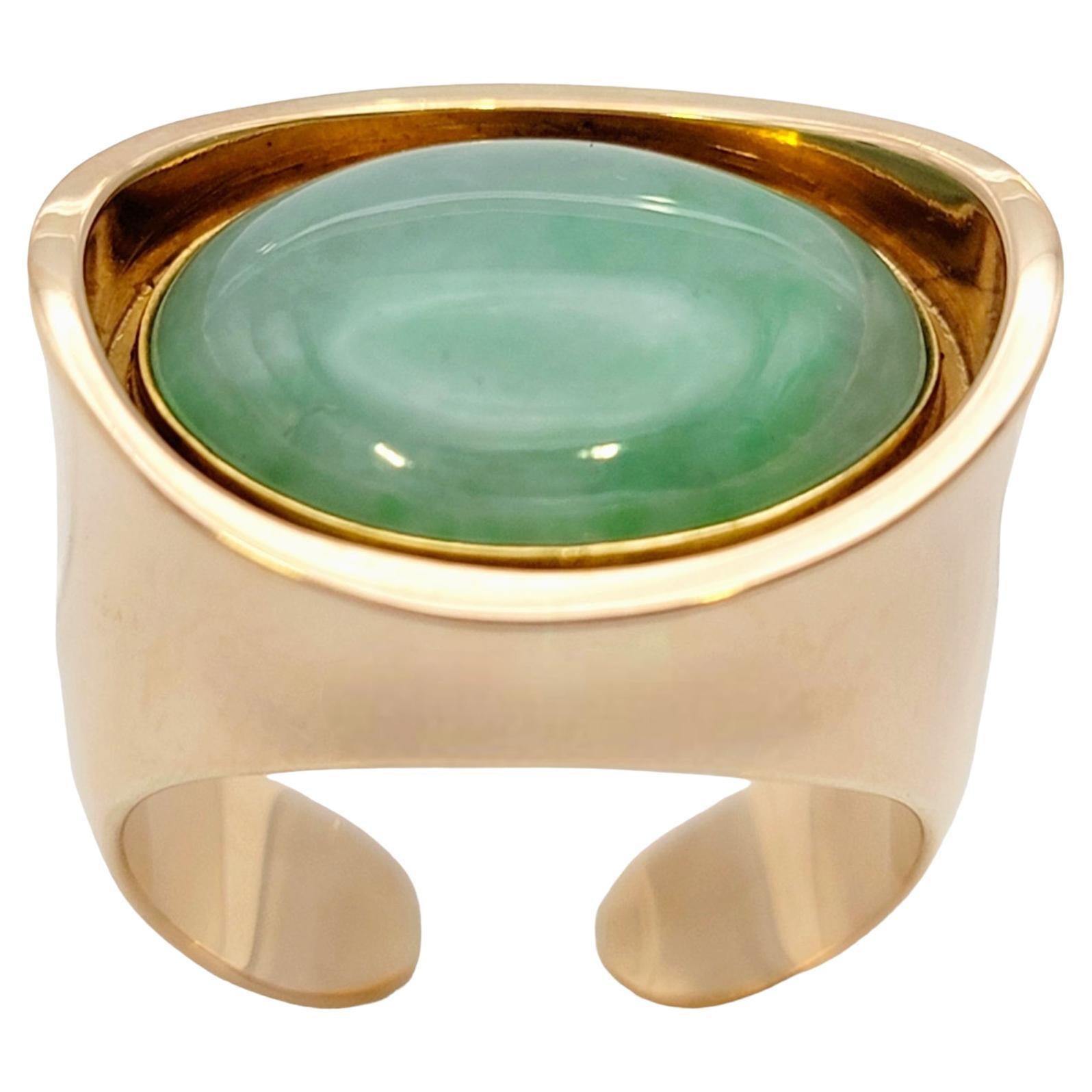 Ring size: 7

Introducing a truly stunning vintage jade cocktail ring, a masterpiece of fine craftsmanship and undeniable elegance. This alluring ring, crafted by esteemed designer Bent Knudsen, showcases a captivating oval cabochon jade gemstone in
