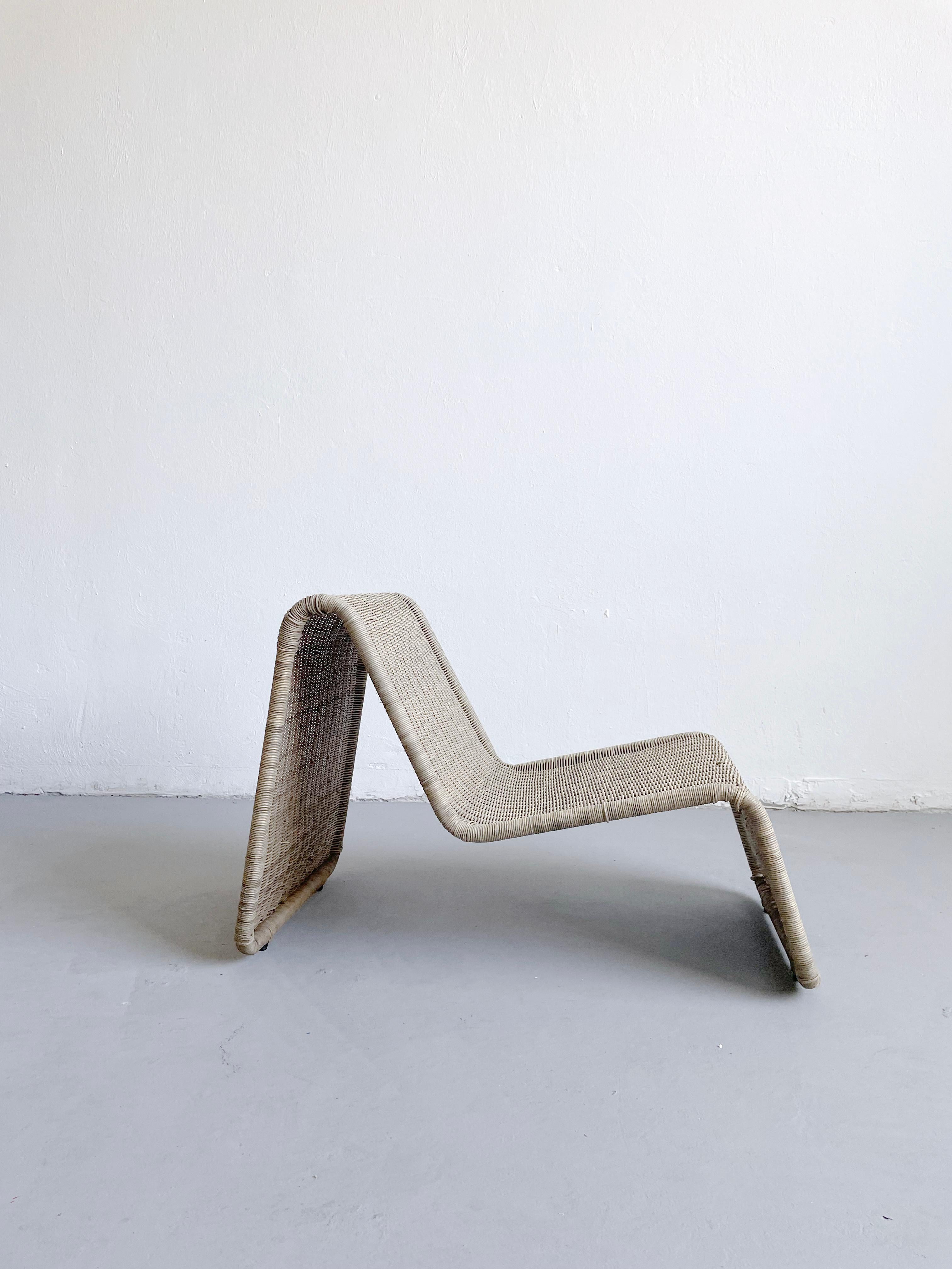 Minimalist, organic, sculptural, and iconic vintage wicker lounge chair manufactured by IKEA in the 1980s. 
The design of the chair is almost an identical copy of the 1960s P3 lounge chair by notable Italian designer Tito Agnoli. 

The chair offered