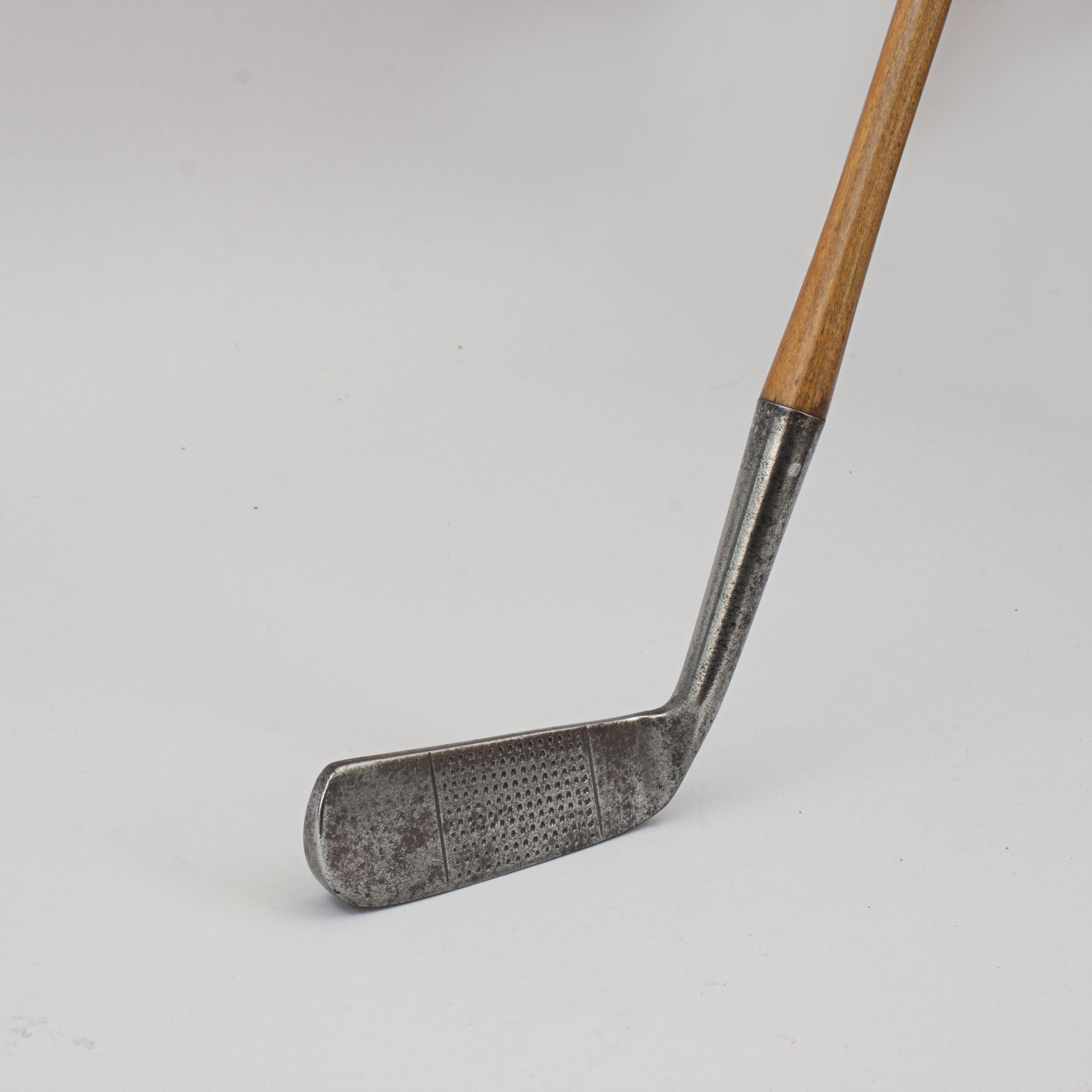 Vintage Bent Neck Putter, Pixie By Haskins Of Hoylake.
A fine and nicely weighted dot punched faced offset putter, wryneck putter by Haskins of Hoylake. The hickory shaft with polished leather grip, the rear of the club head marked 'PIXIE,