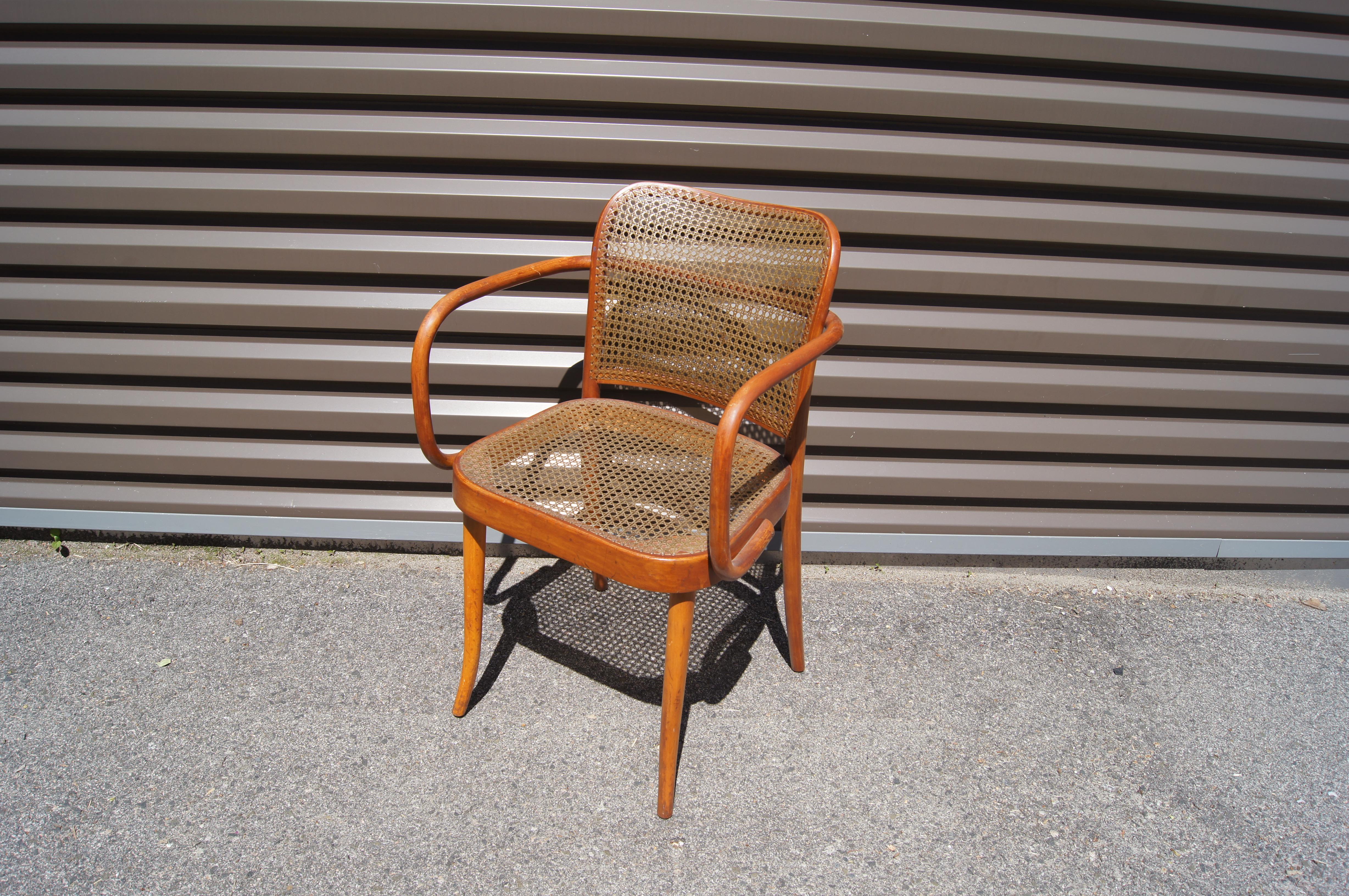 This Classic bentwood armchair, designed in 1925 by Josef Hoffmann in collaboration with Josef Frank and manufactured in the 1950s by Stendig, features a warm beechwood frame and a rare handwoven nylon seat. 

Original Stendig label.