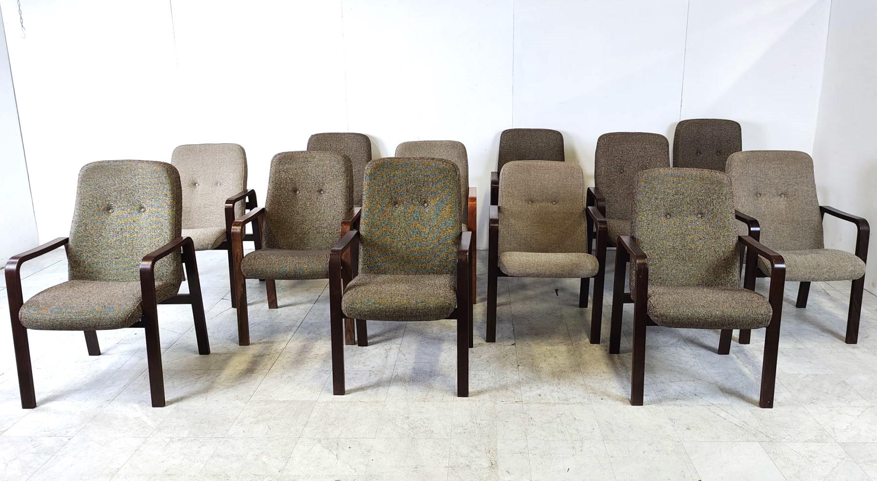 Vintage bent plywood armchairs with thick grey fabric cushions from the 1970s.

Very comfy chairs.

Can be used as conference chairs, dining chairs, or as side chairs in the living room.

Timeless design.

12 pieces in stock, price is per