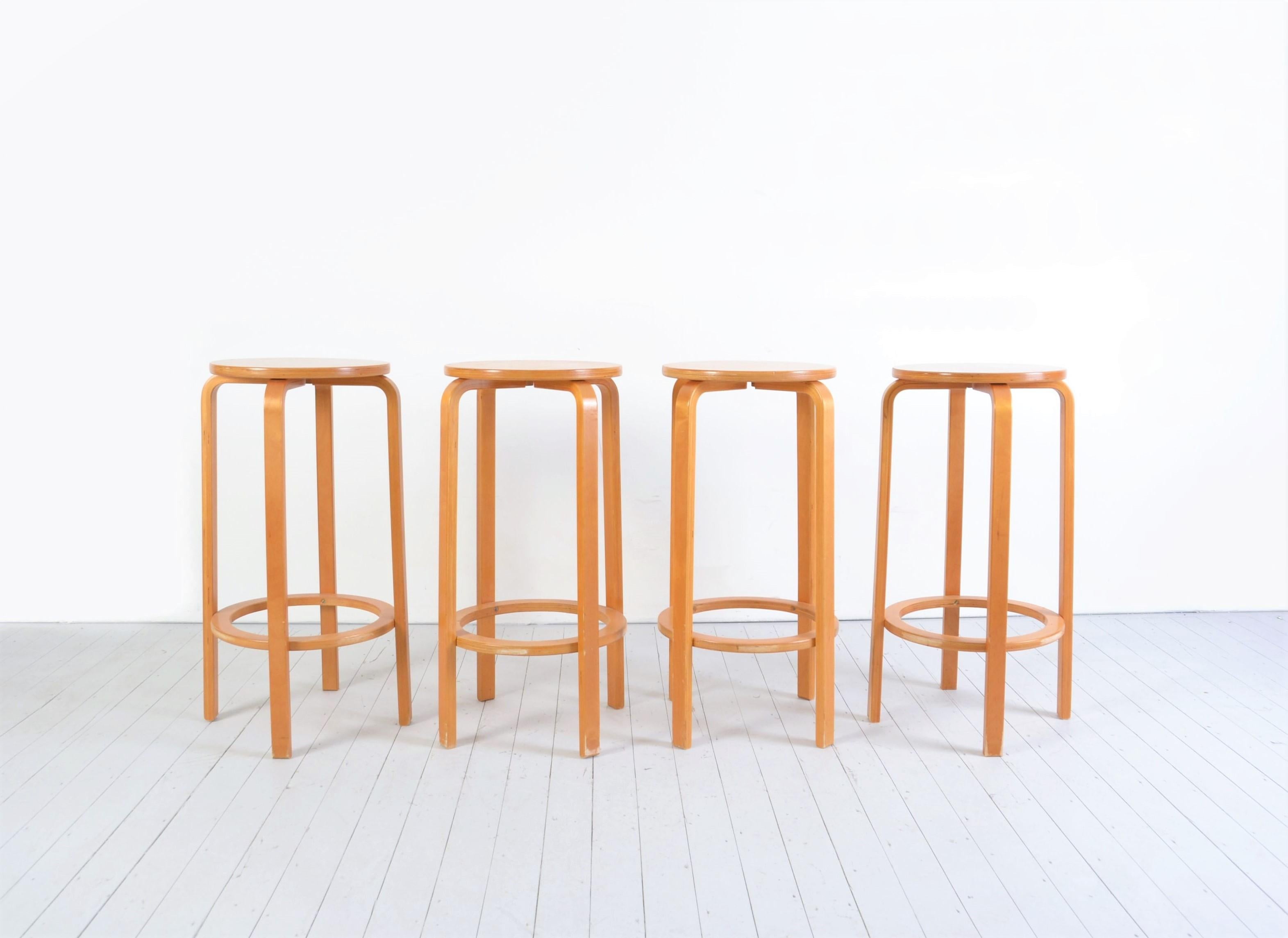 These stools are made out of bended beech wood and are characteristic of the style of Alvar Aalto. The stools are in good condition but may show some signs of use consistent to there age.
