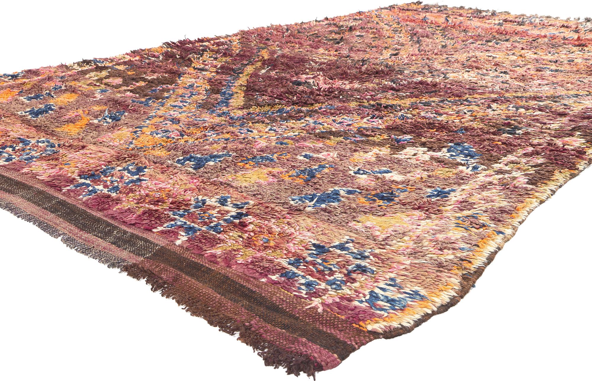 21329 Vintage Beni MGuild Moroccan Rug, 05'11 x 10'07.
In the enchanting embrace of the Atlas Mountains in Morocco, the skilled hands of Berber women from the Ait M'Guild tribe weave captivating narratives through the artistry of Beni Mguild rugs.