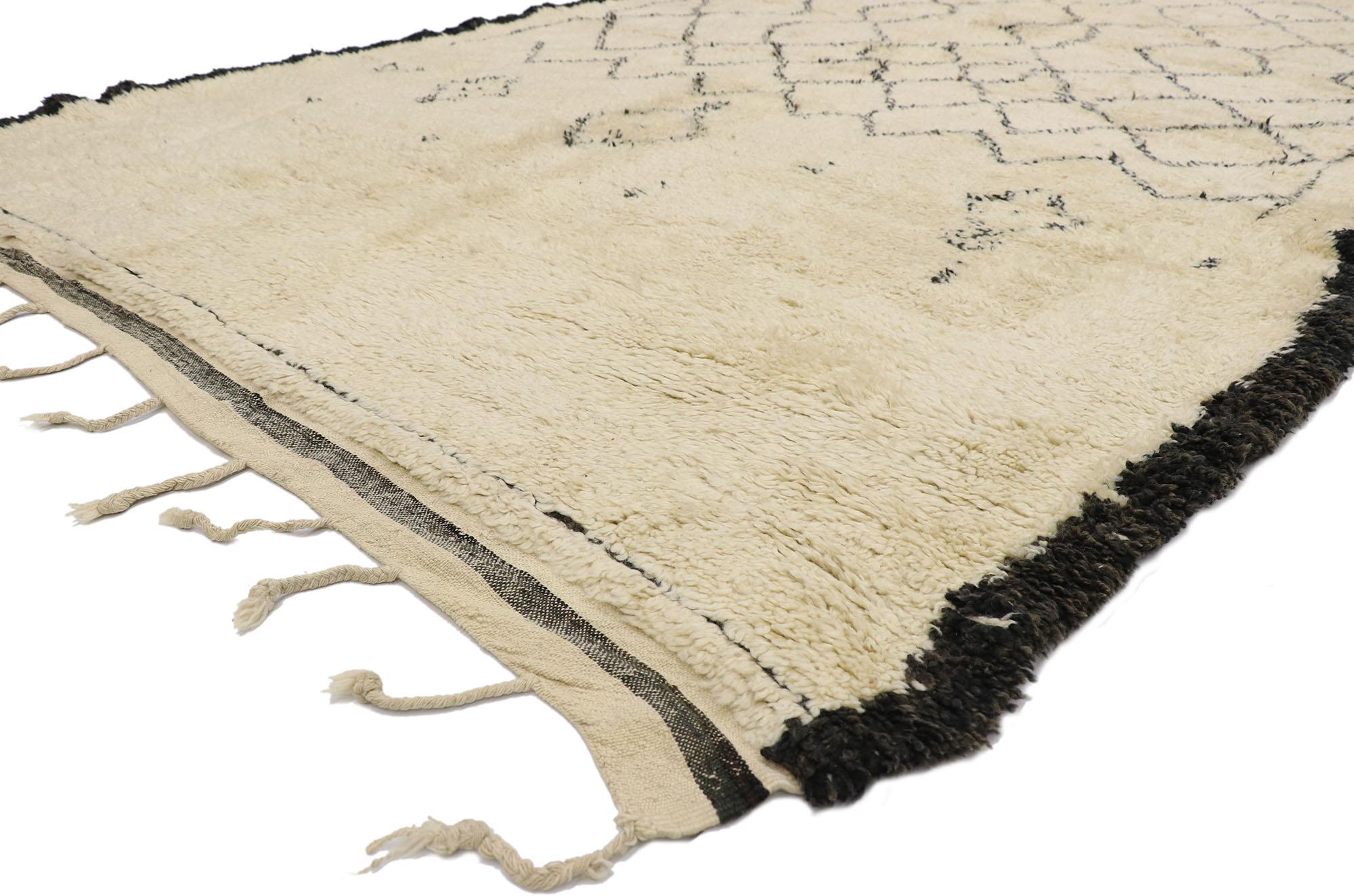 21376 Vintage Berber Beni Ourain Moroccan rug with Mid-Century Modern Style 07'00 x 11'00. With its simplicity, plush pile and Mid-Century Modern style, this hand knotted wool vintage Berber Beni Ourain Moroccan rug is a captivating vision of woven