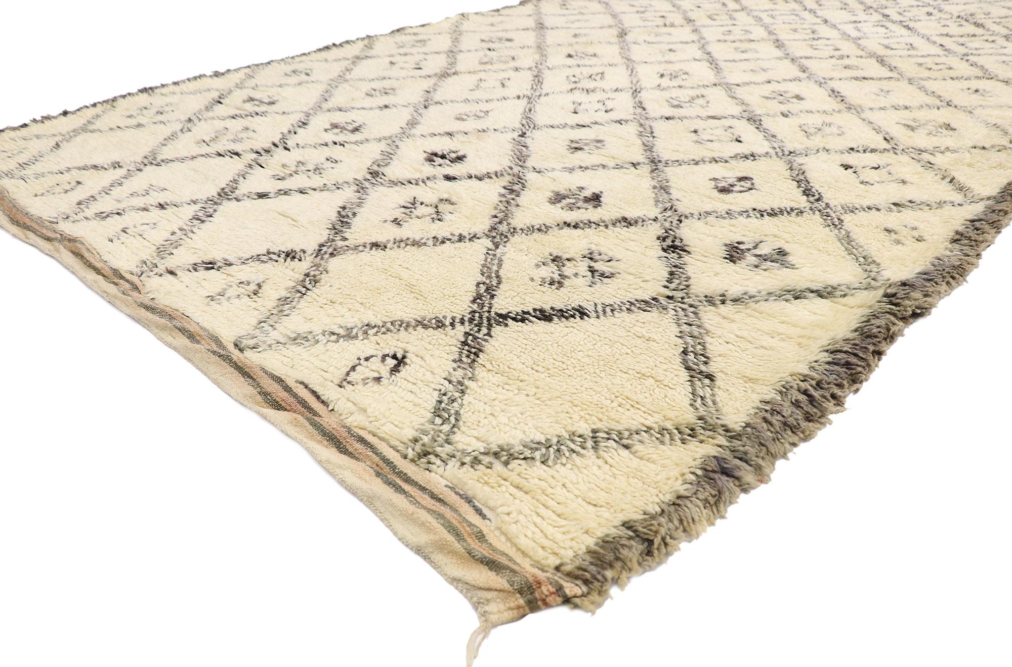 21389 Vintage Berber Beni Ourain Moroccan rug with Tribal Style 06'04 x 11'03. With its simplicity, plush pile and tribal style, this hand knotted wool vintage Berber Beni Ourain Moroccan rug is a captivating vision of woven beauty. It features a