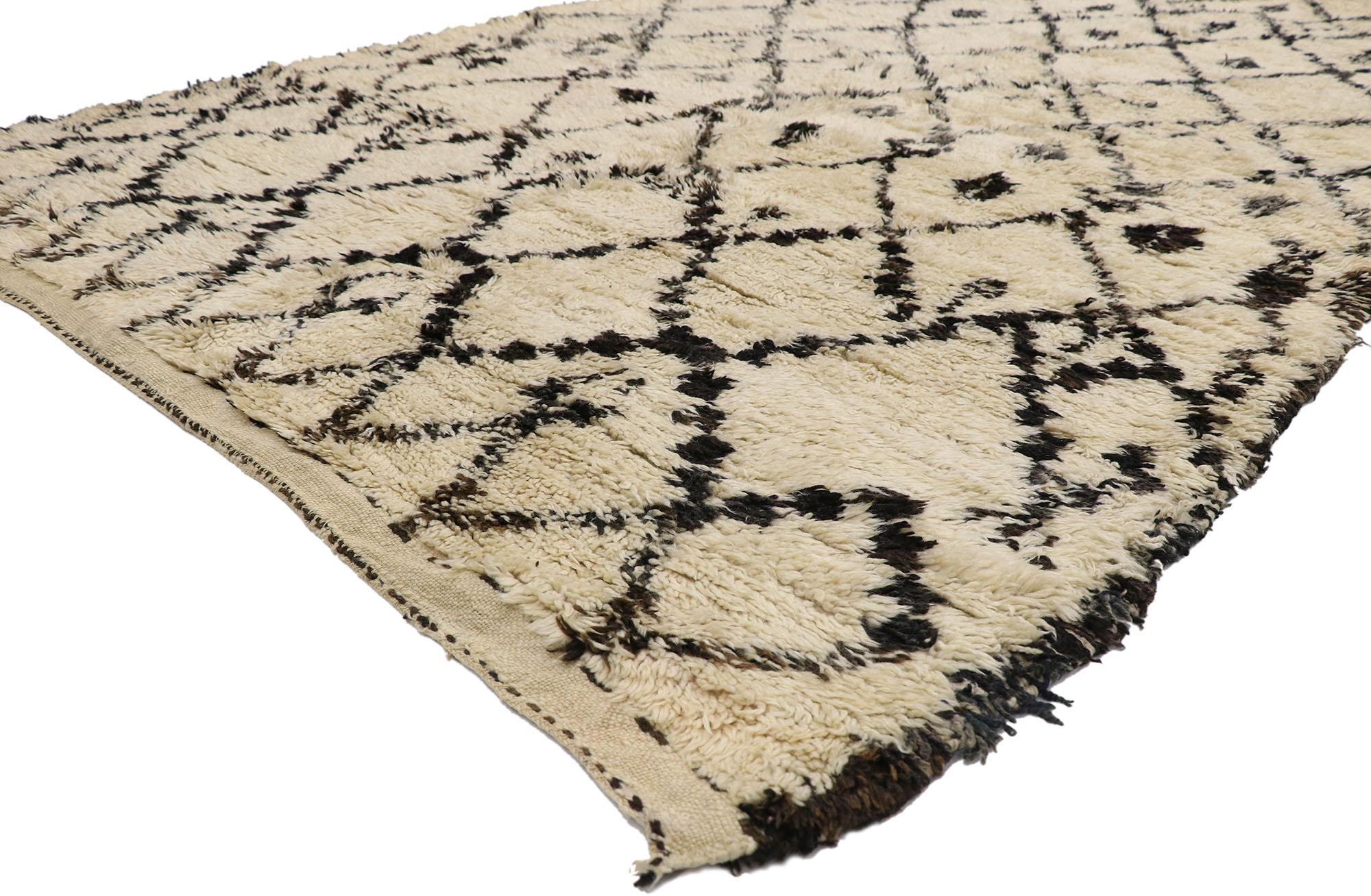 21409 Vintage Berber Beni Ourain Moroccan rug with Tribal Style 06'05 x 10'02. With its simplicity, plush pile and tribal style, this hand knotted wool vintage Berber Beni Ourain Moroccan rug is a captivating vision of woven beauty. It features a