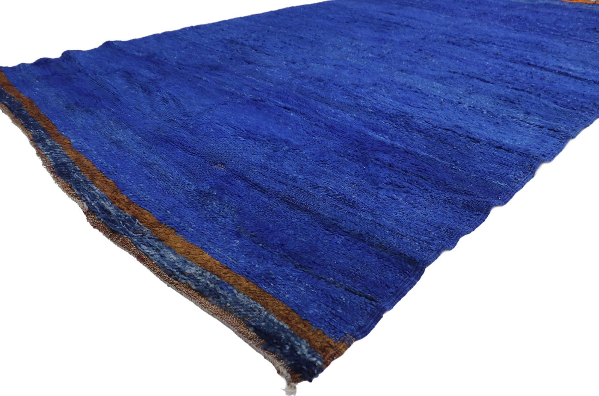 21286 Vintage Berber Blue Moroccan rug 05'10 x 11'02. With its simplicity, plush pile and Bohemian vibes, this hand knotted wool vintage Berber Moroccan rug is a captivating vision of woven beauty. Imbued with blue hues, the rich waves of abrash of