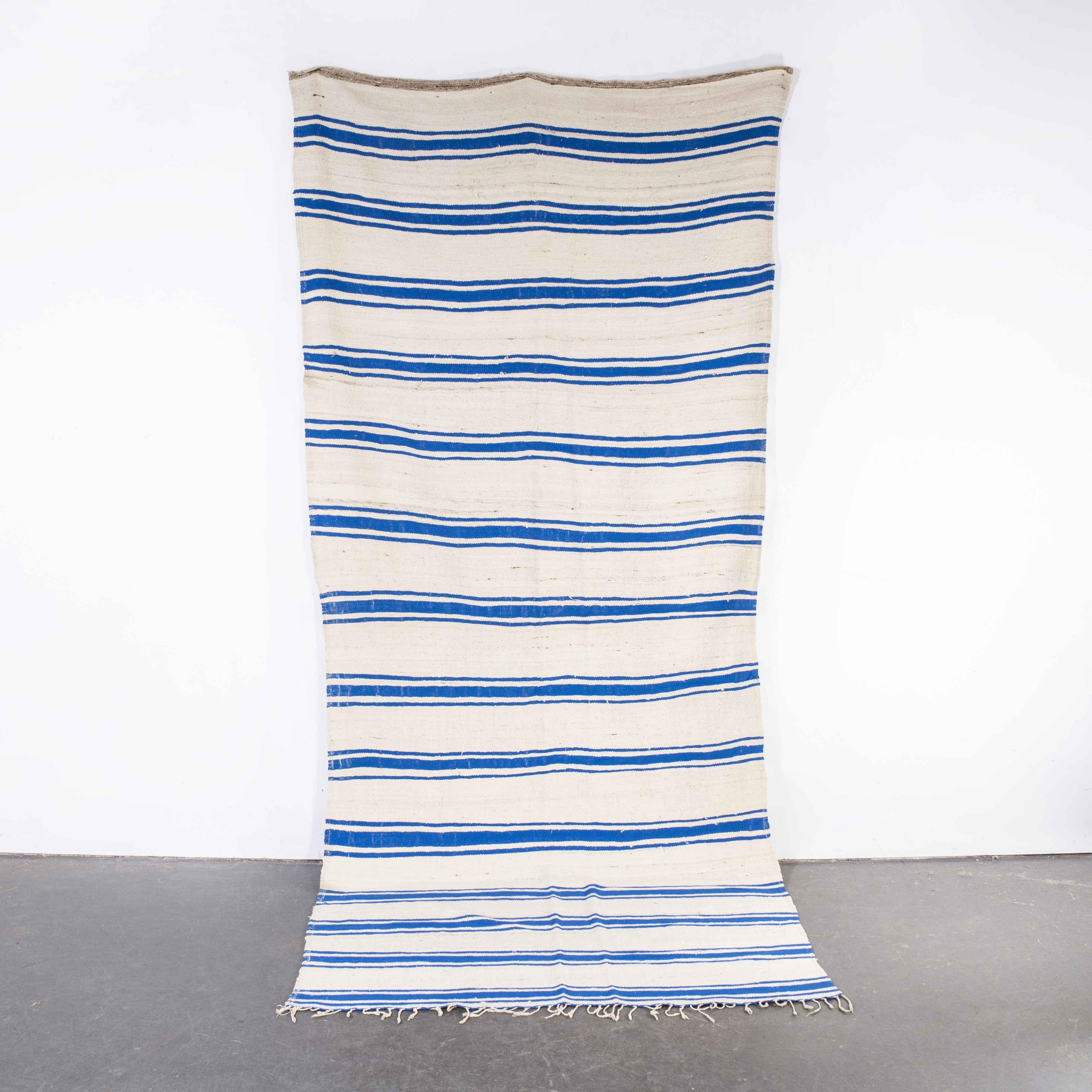 Vintage Berber Blue Stripe Hanbel Rug
Vintage Berber Blue Stripe Hanbel Rug. These are flat-woven rugs (Hanbel in Arabic) which are light in weight due to the lack of pile. They are often used on floors in hotter countries as they are easy to just