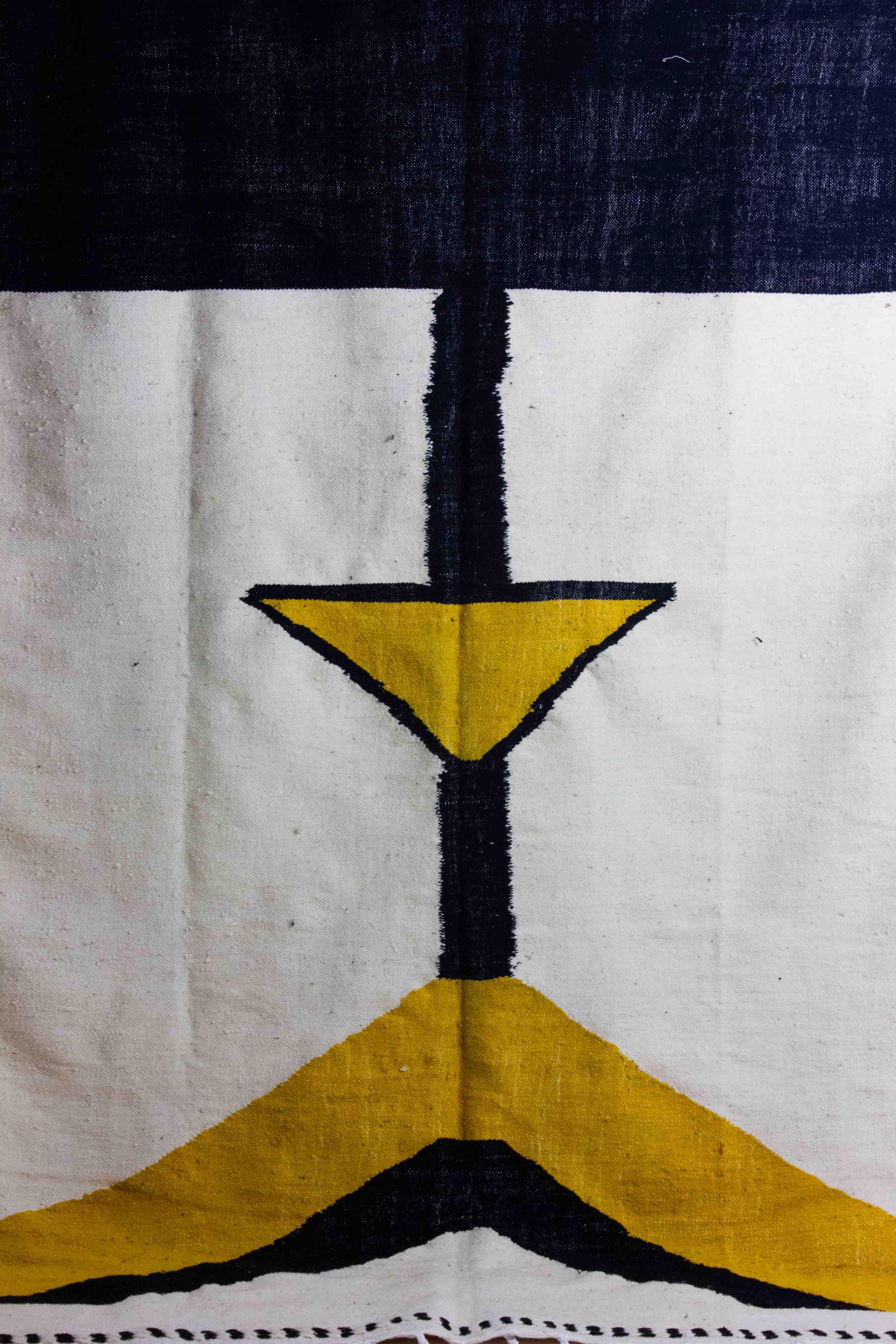 Vintage Tribal Moroccan Berber Rug: This striking rug features a mix of beige, yellow and black colors made with natural, organic dyes. A stunning example of Abstract Modernist Art, it originates from the Atlas Mountains of Morocco and was handwoven