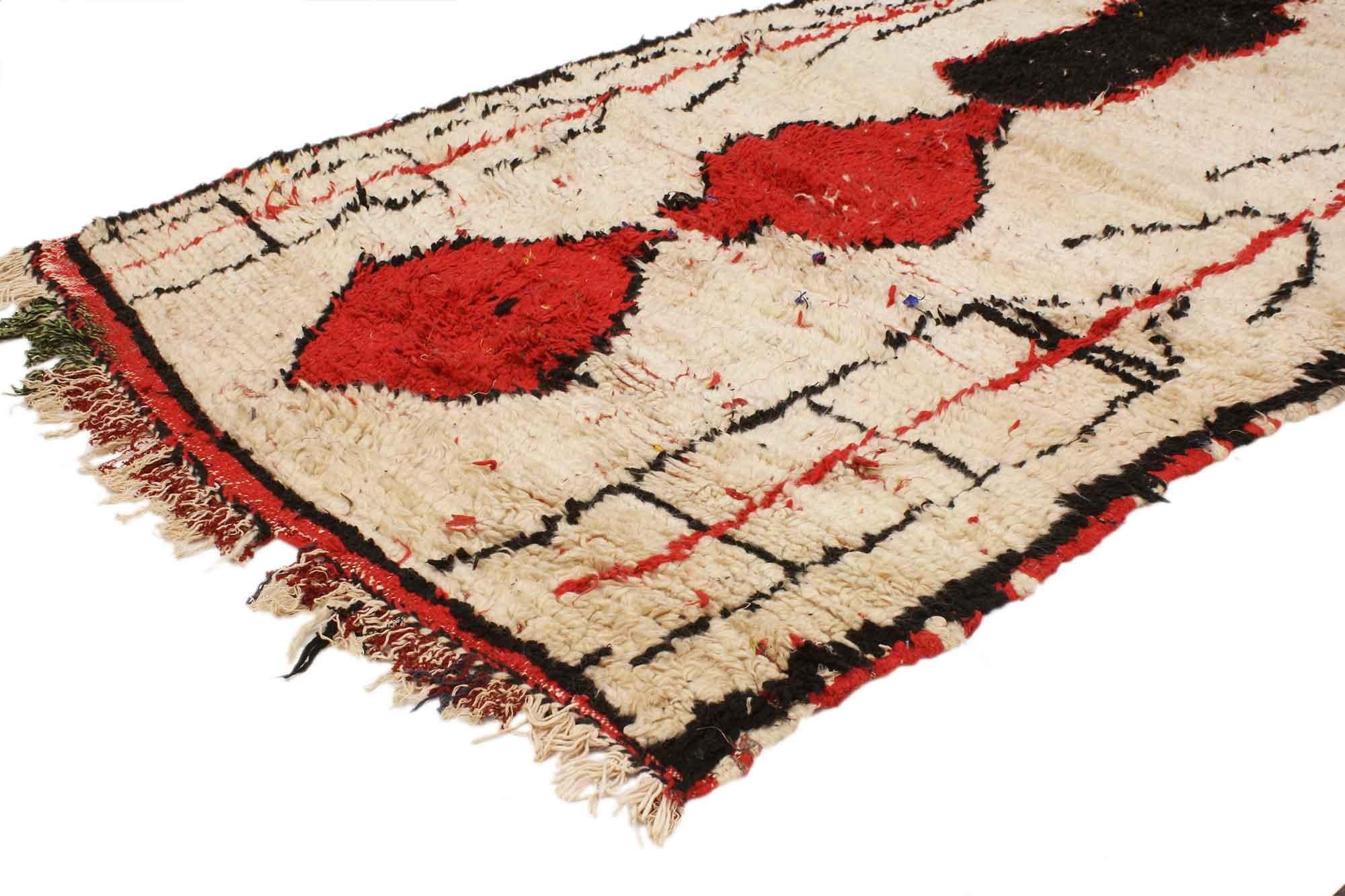 20372 Vintage Berber Moroccan Azilal runner 03’07 x 09’06. Showcasing a bold expressive design, incredible detail and texture, this hand knotted wool vintage Berber Moroccan Azilal rug is a captivating vision of woven beauty. The eye-catching