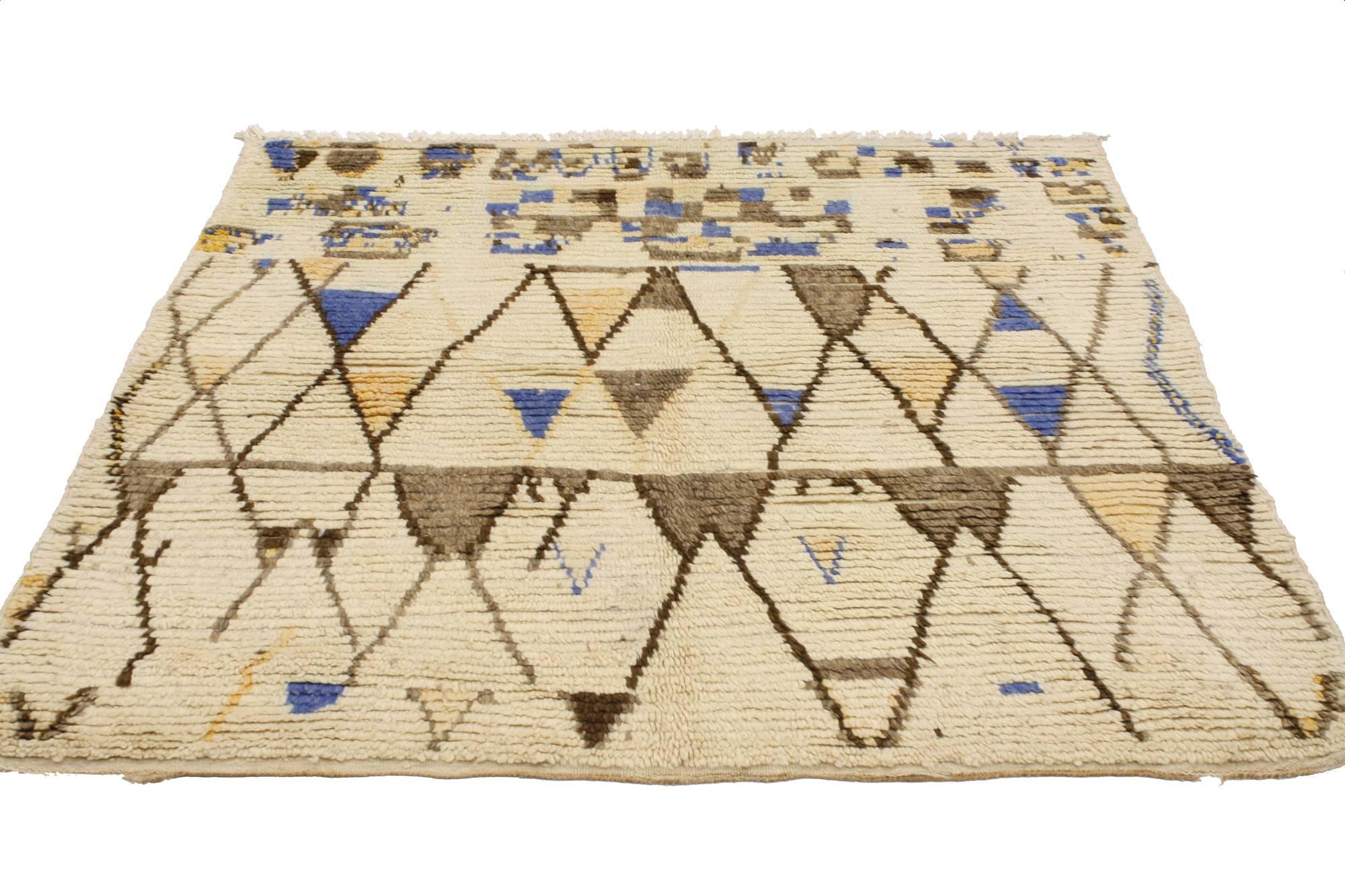 20512, vintage Berber Moroccan Azilal rug. The warm brown, mocha, coffee, light yellow, sand, beige and the cool blue colors conjure the tribal feeling of Moroccan spirit in this Vintage Berber Moroccan Azilal rug. The different colored lines create