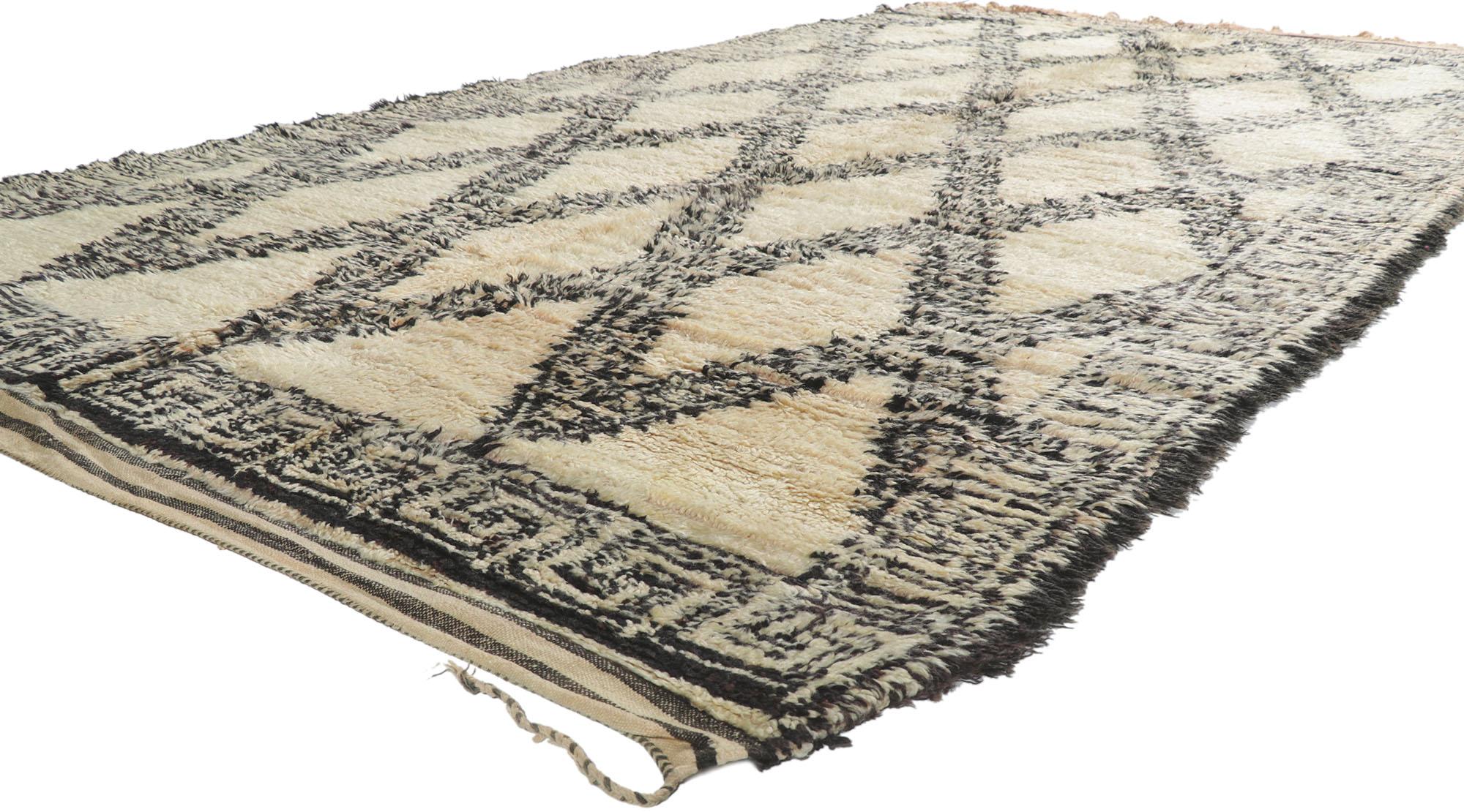 21360 Vintage Moroccan Beni Ourain Rug, 06'05 x 11'06.
Cozy boho meets Cycladic style in this hand knotted wool vintage Berber Beni Ourain Moroccan rug. The detailed design and neutral colorway woven into this piece work together creating warm and