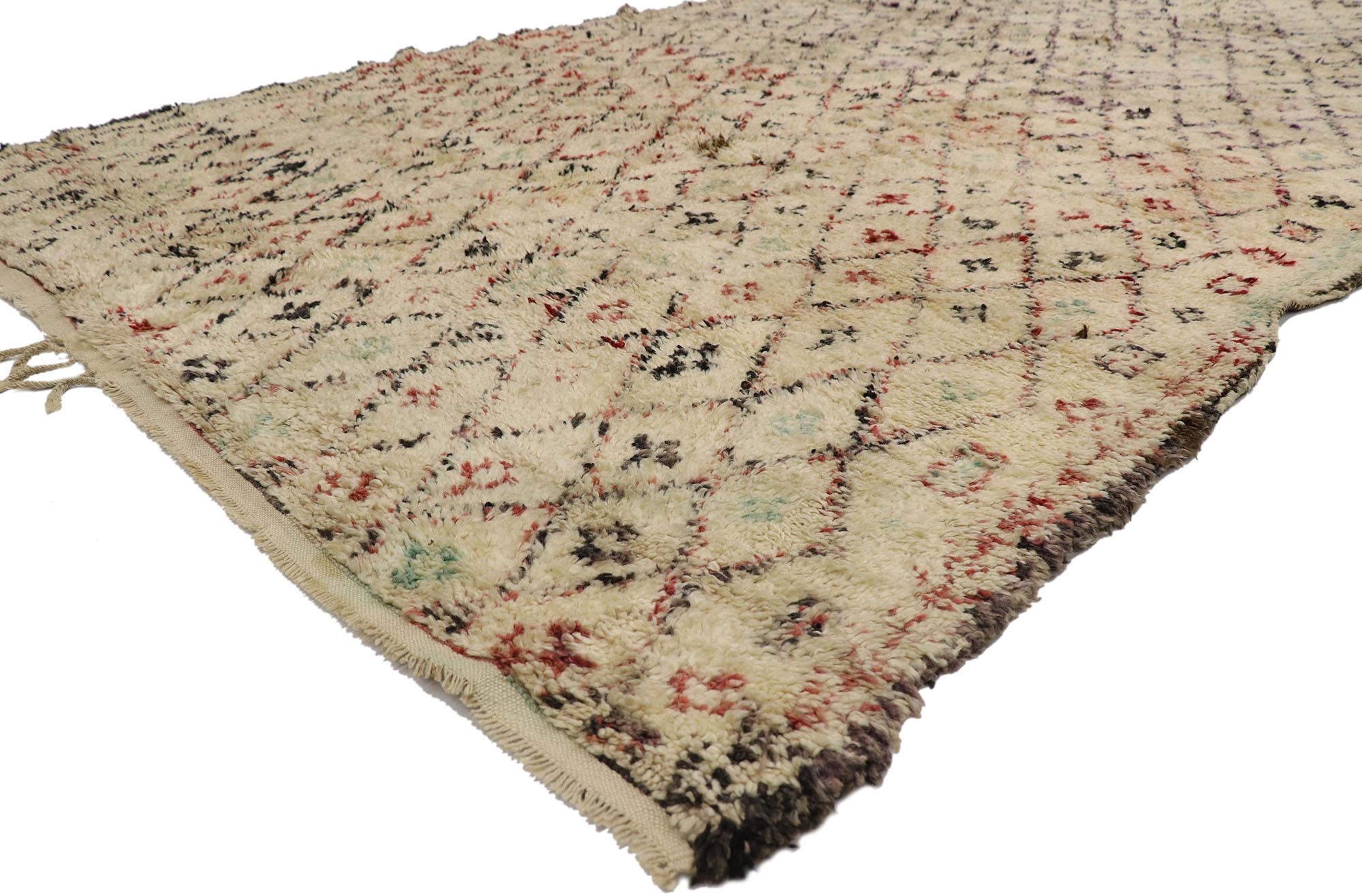 21513, vintage Berber Moroccan Beni Ourain rug with Tribal style. With its simplicity, plush pile and tribal style, this hand knotted wool vintage Berber Beni Ourain Moroccan rug is a captivating vision of woven beauty. It features a diamond lattice