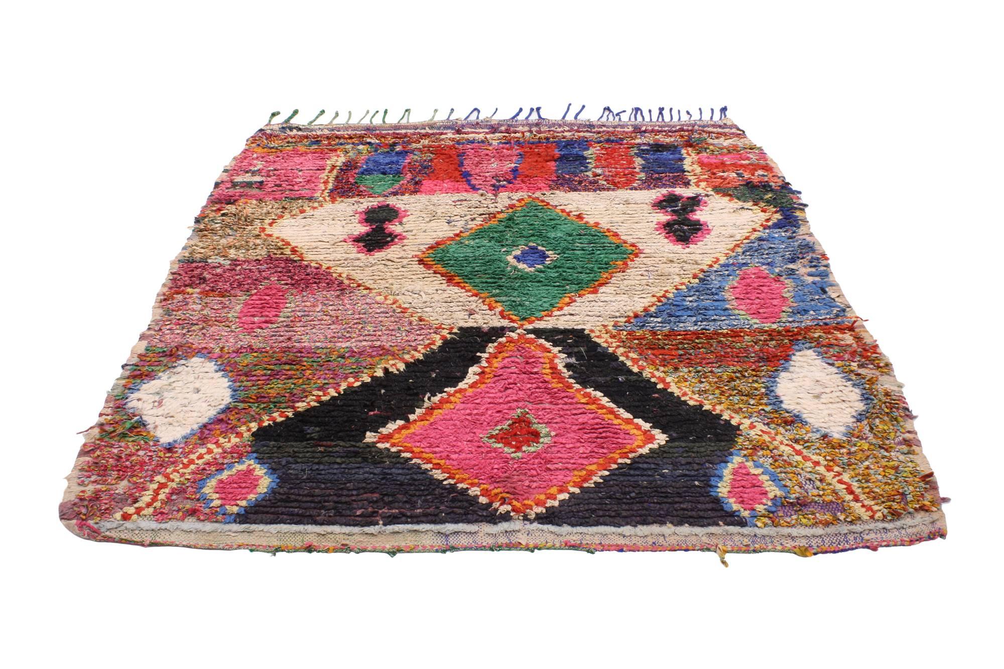 20477, vintage Berber Moroccan Boucherouite rug. Vivacious shades of the colors woven into this Moroccan rug work together to create a truly vibrant and life-giving feel. The vibrant colors and primitive charm conjures the tribal feeling of Moroccan