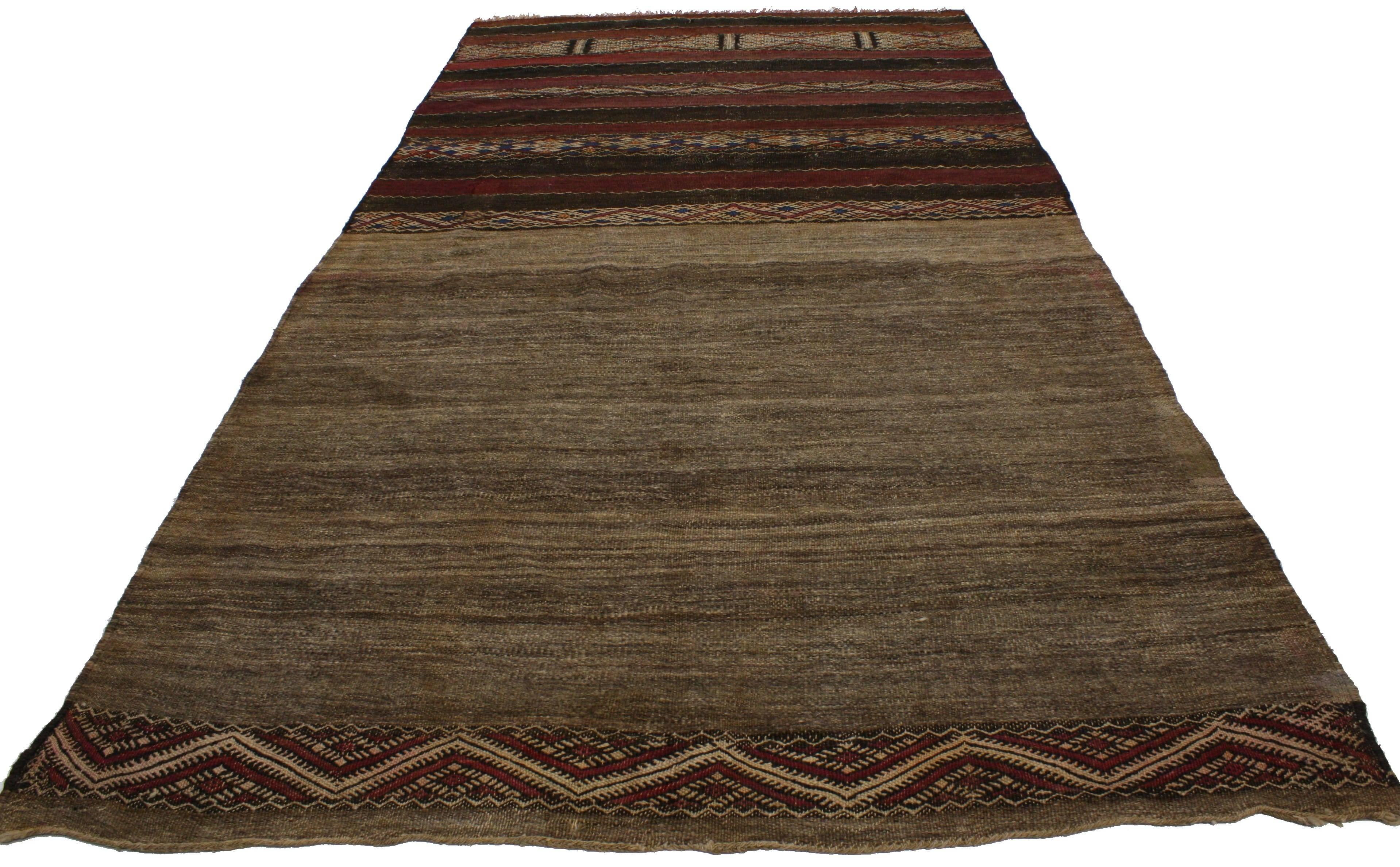 20216, vintage Berber Moroccan Kilim rug, flat-weave tribal rug. Dark and rich earth tones provide a beautiful color scheme for the design featured on this vintage Berber Moroccan Kilim rug. This piece is rich in ancient Berber culture, as the