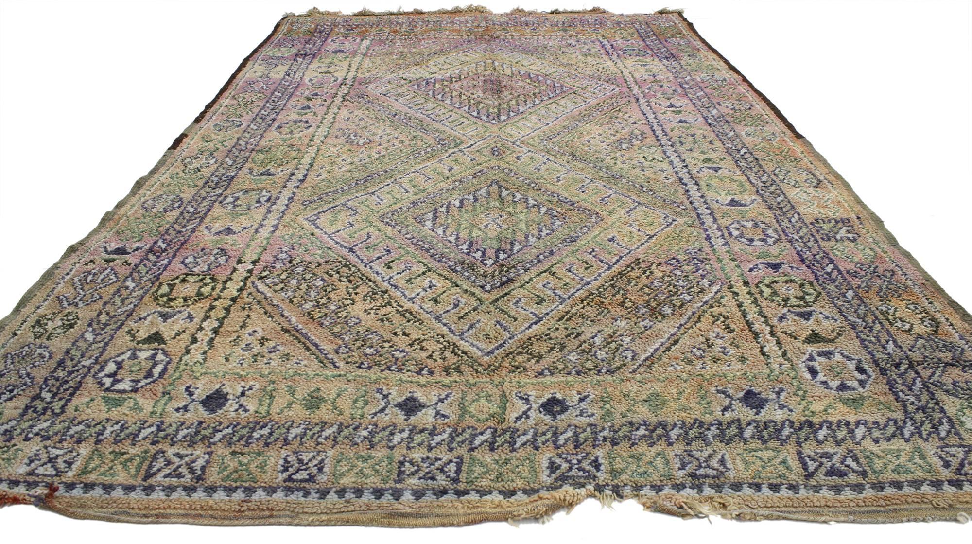 20594, vintage Berber Moroccan rug 6'01 x 9'07. A myriad of beautiful colors and symbols so rich in Ancient Berber culture give this rug a special and unprecedented flair. Blue,  amethyst, primrose, soft green, and orange are just a few of the