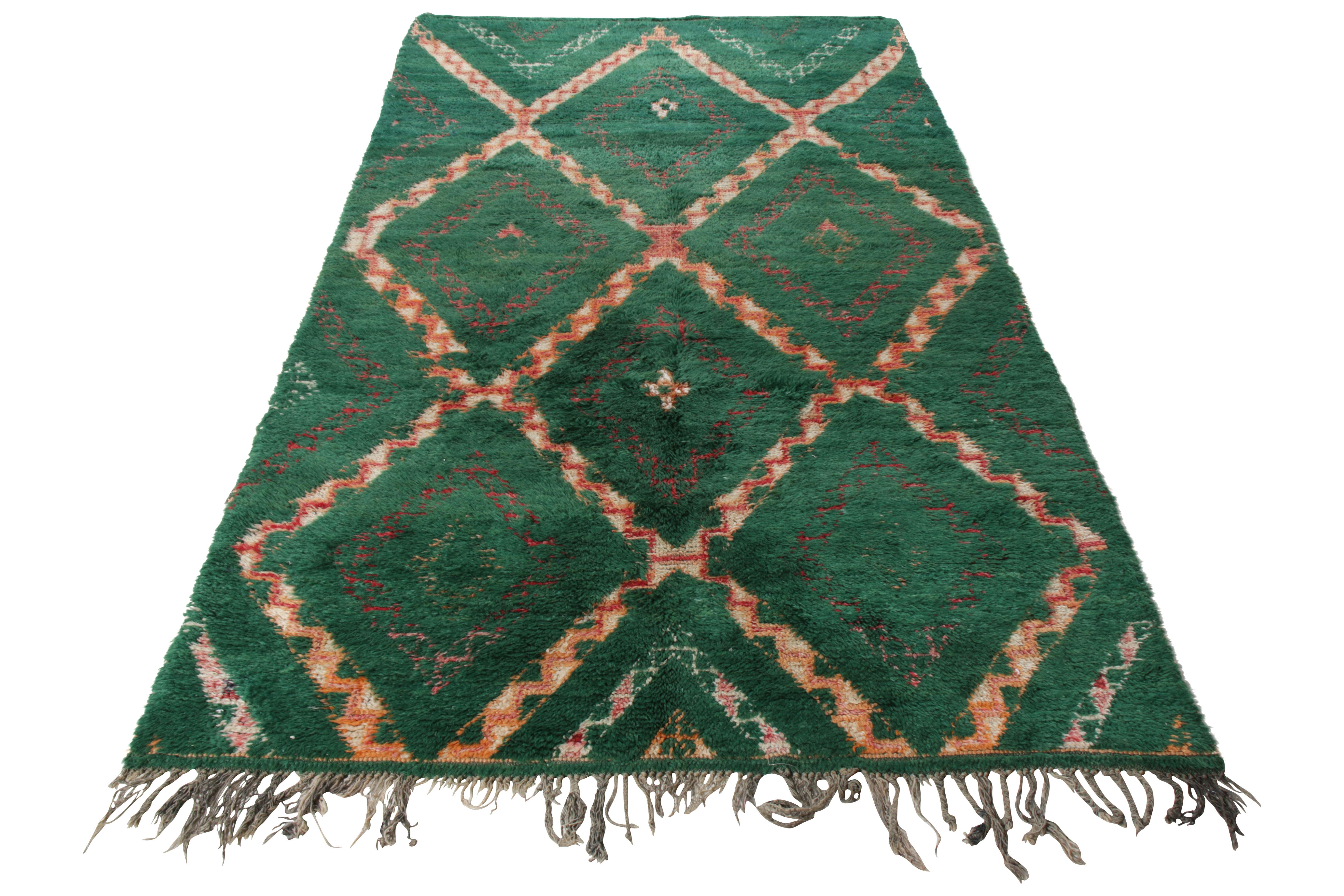 Hand knotted in lush wool pile, a 5x10 Berber style Moroccan runner joining Rug & Kilim’s diverse Moroccan rug collection. Originating circa 1950-1960, this piece enjoys a shag texture with a well defined geometric pattern in hues of green and
