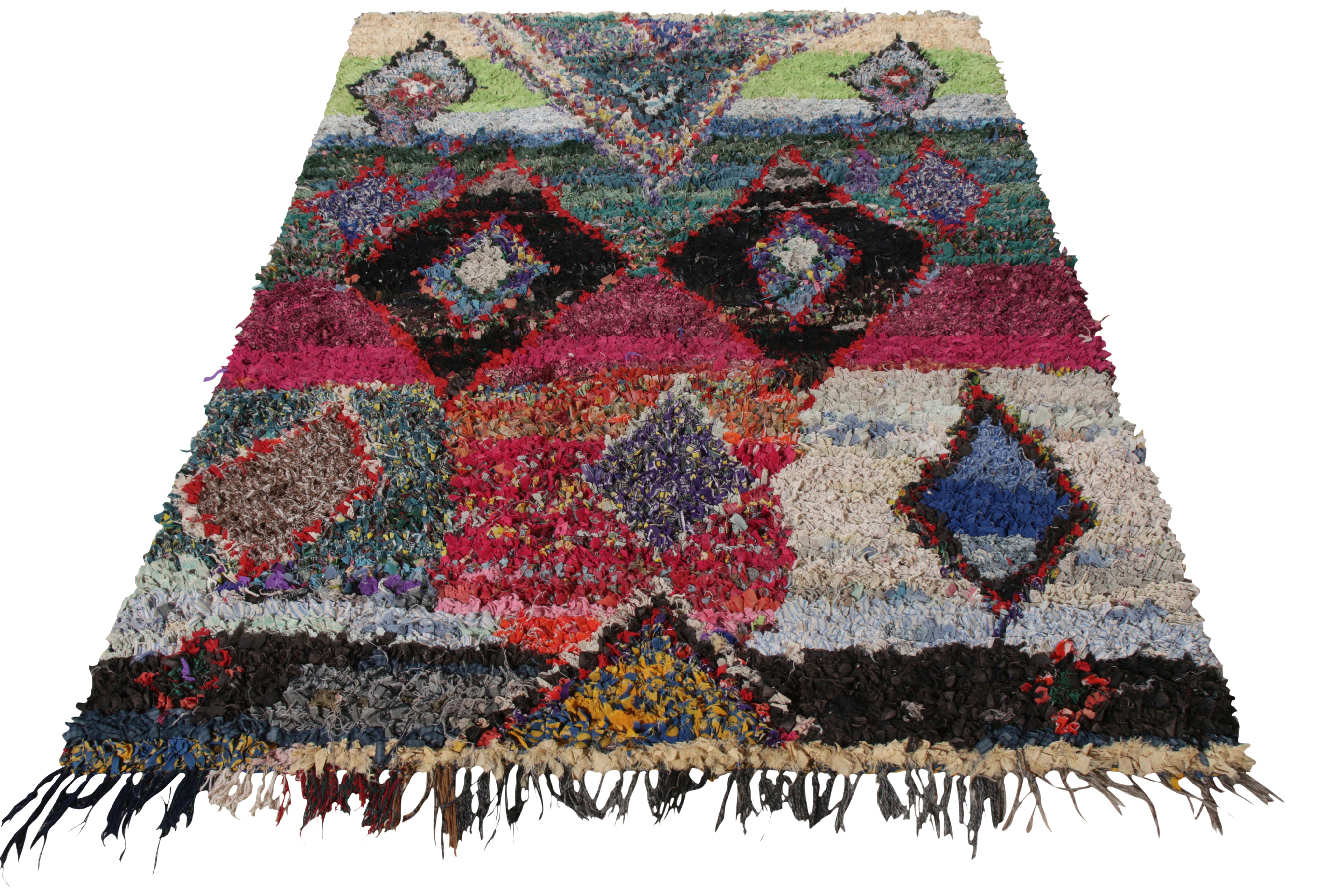 Hand-knotted in Boucherouite fabric circa 1950-1960, a vintage Berber Moroccan tribal rug from Rug & Kilim’s titular collection. The rug carries a shag, high pile textural beauty with a multicolor geometric pattern that lends a gorgeous sense of