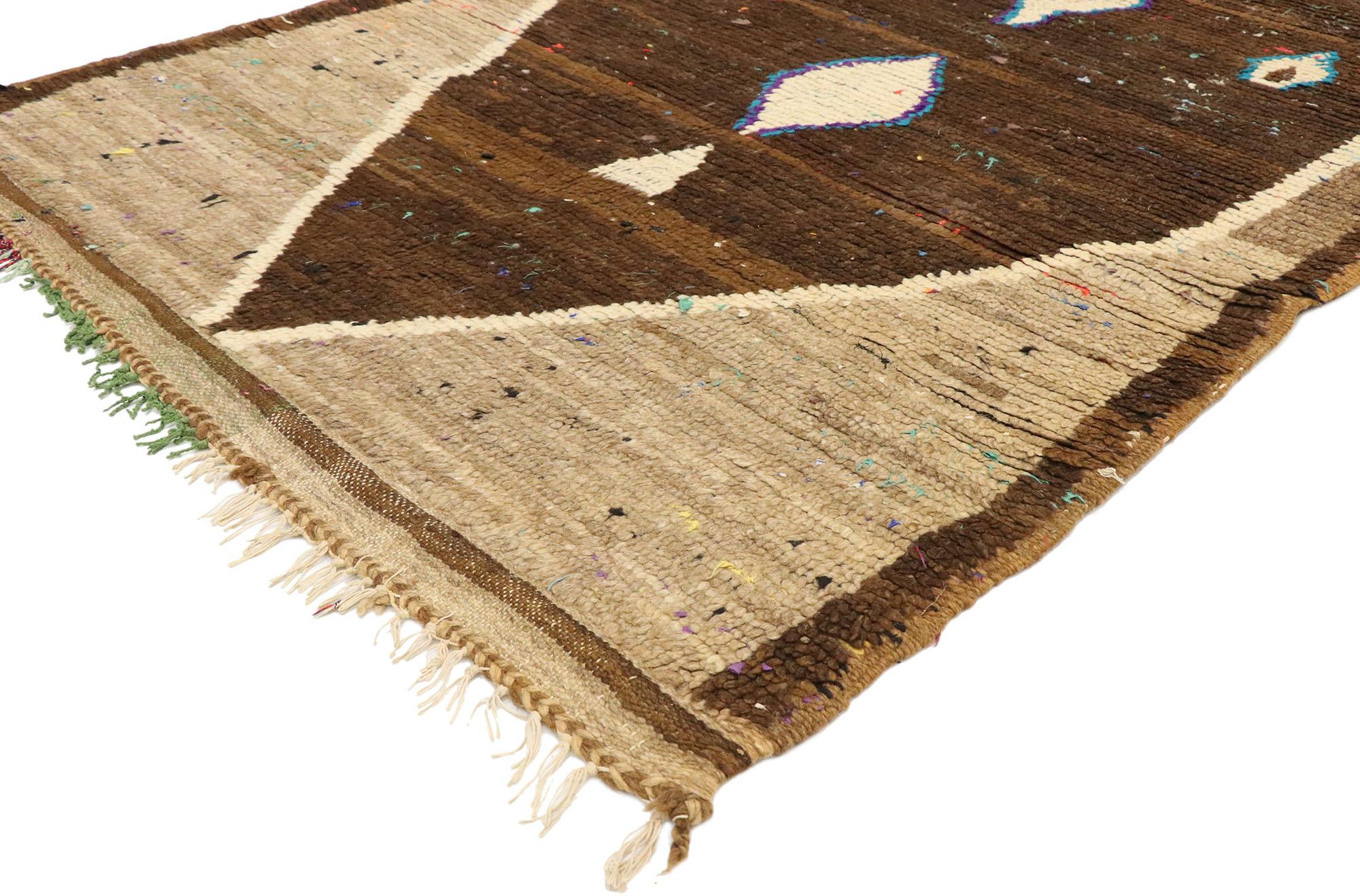20582 Vintage Brown Moroccan Rug, 03'05 x 08'08. In this vintage Berber Moroccan rug runner, a medley of earthy browns creates a captivating backdrop, harmonizing with the intricately woven design at its core. At the heart of the rug lies a dominant