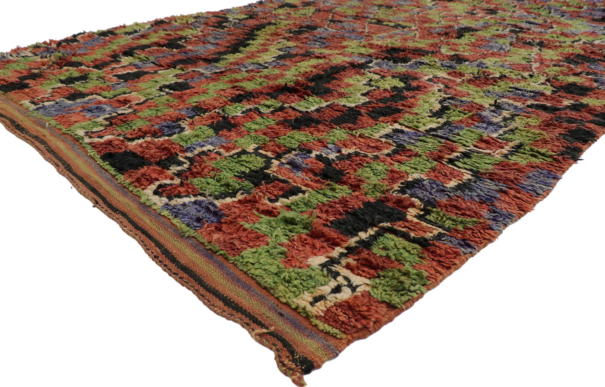 21295 Vintage Ait Bou Ichaouen Moroccan Rug, 06'11 x 11'03.
Emanating nomadic charm with incredible detail and texture, this hand knotted wool Ait Bou Ichaouen Moroccan rug is a captivating vision of woven beauty. The visual complexity and lively