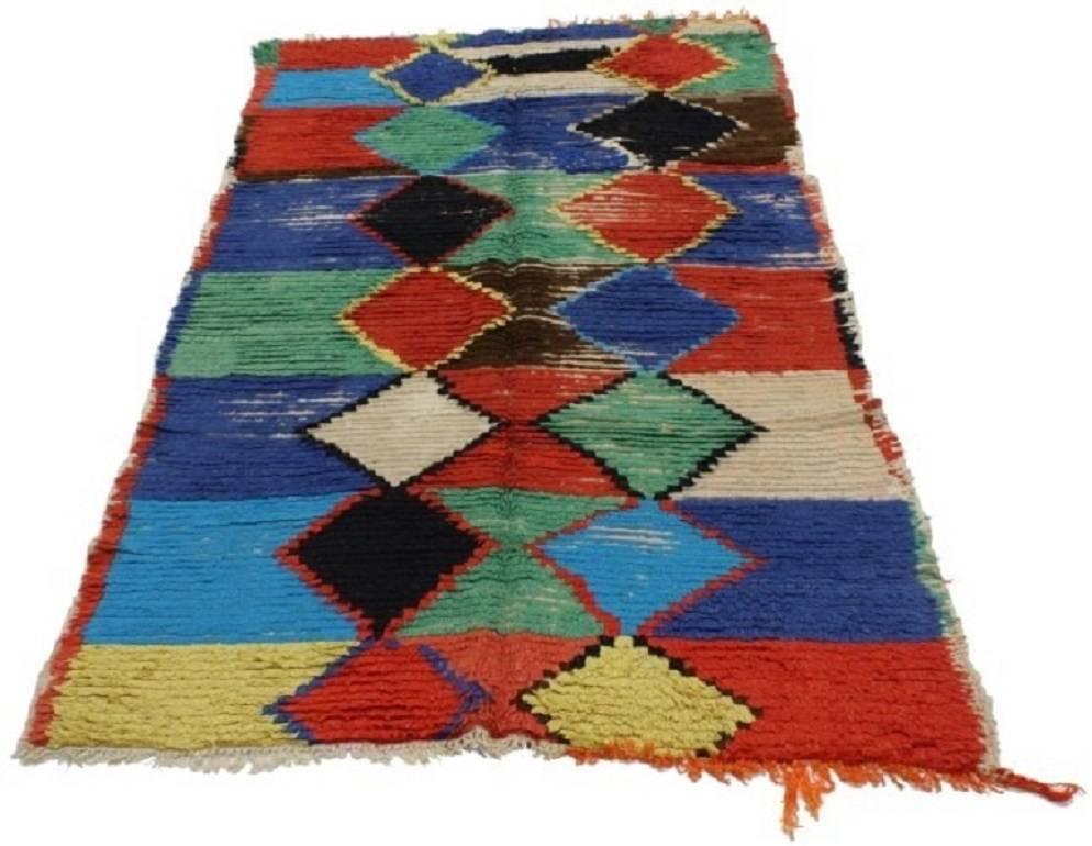 20027, vintage Berber Moroccan rug with tribal style. It is easy to love this vintage Berber Moroccan rug with Tribal style. Its unique and colorful composition can make an interior space feel cheerful, modern and full of character. This Moroccan