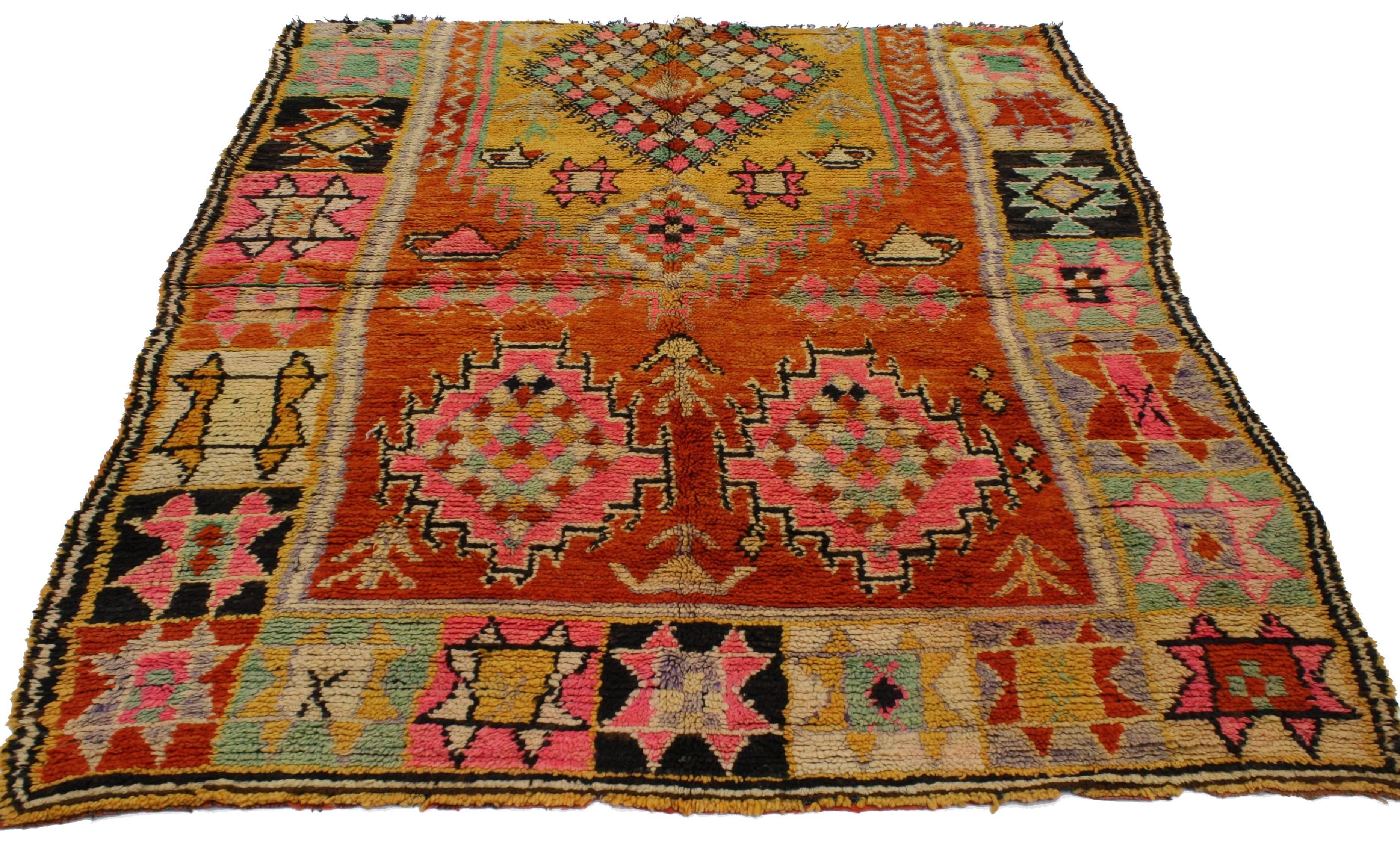 20043, vintage Berber Moroccan rug with tribal style. This impressive vintage Berber Moroccan rug features a mihrab-like niche pattern with colorful symbolism throughout the centre field and border on three sides. A mustard yellow medallion filled