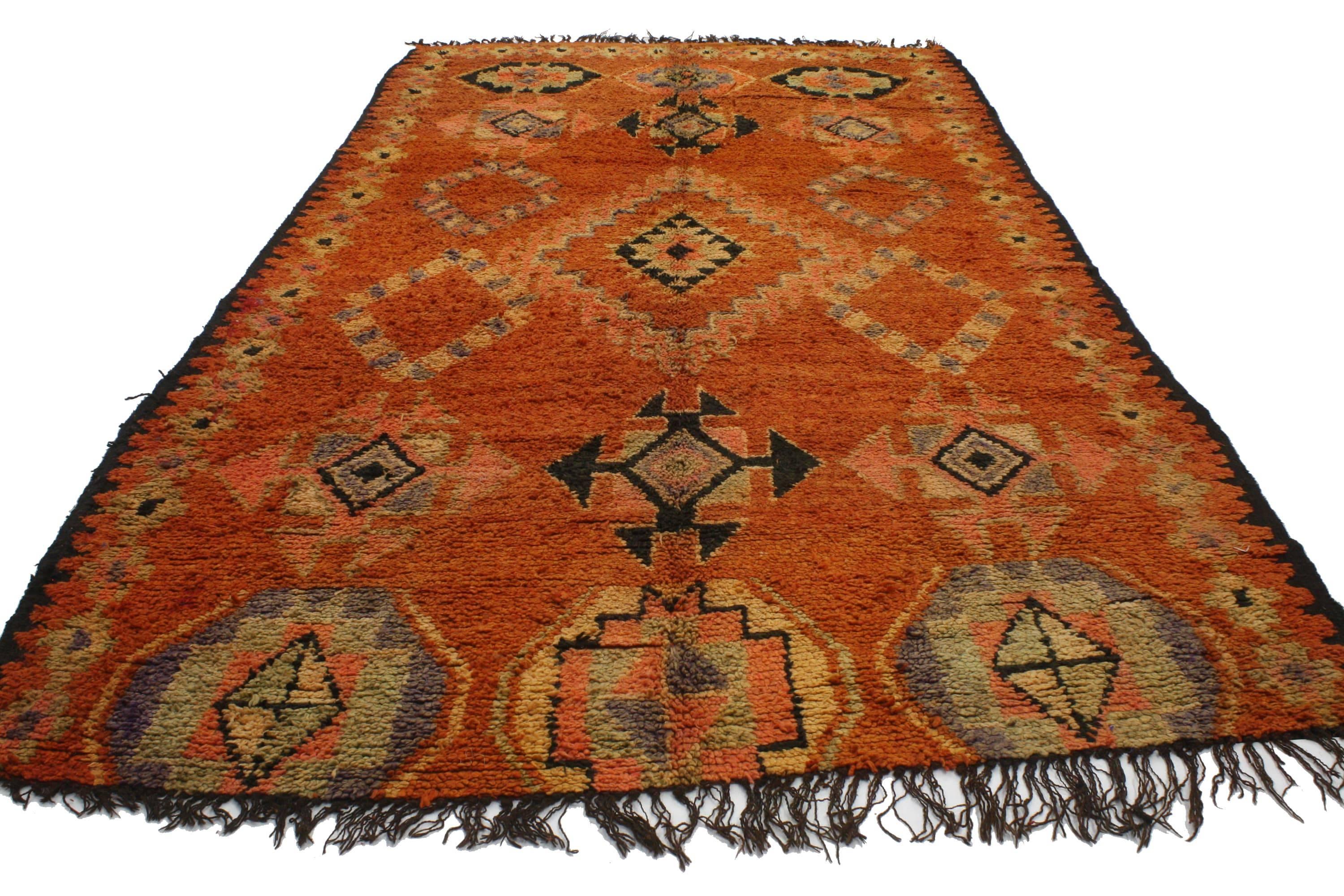 20207, vintage Berber Moroccan rug with tribal style. Vivacious color and rich waves of abrash provide a beautiful backdrop for the ancient Berber tribe symbols that overlay this hand-knotted wool vintage Berber Moroccan rug. Enclosed by a Baraka