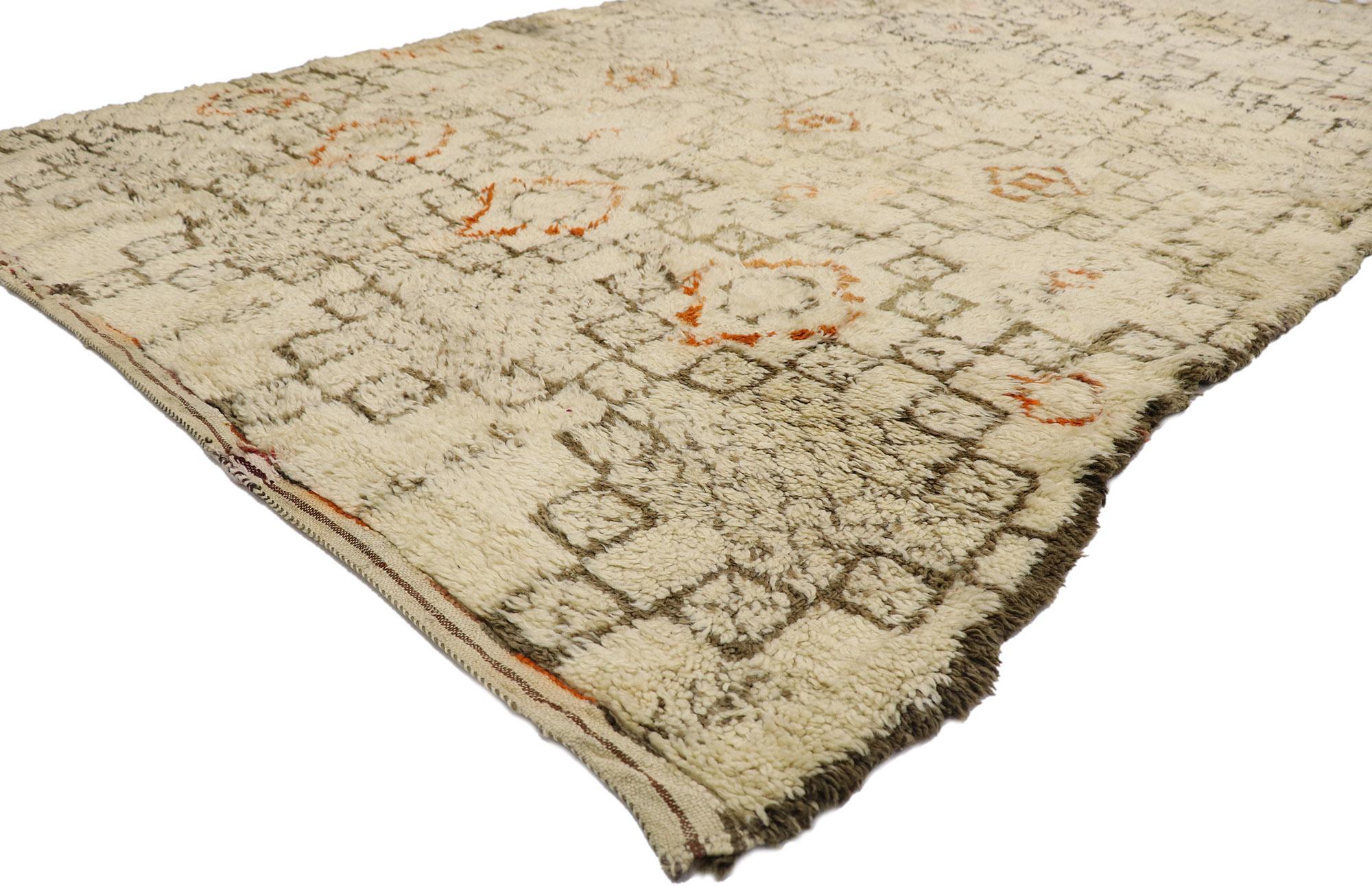 21416 Vintage Beni Ourain Moroccan Rug, 06'05 x 11'00.
Nomadic charm meets global chic in this hand knotted wool vintage Beni Ourain Moroccan rug. The meticulously detailed tribal design and earthy colorway woven into this piece work together