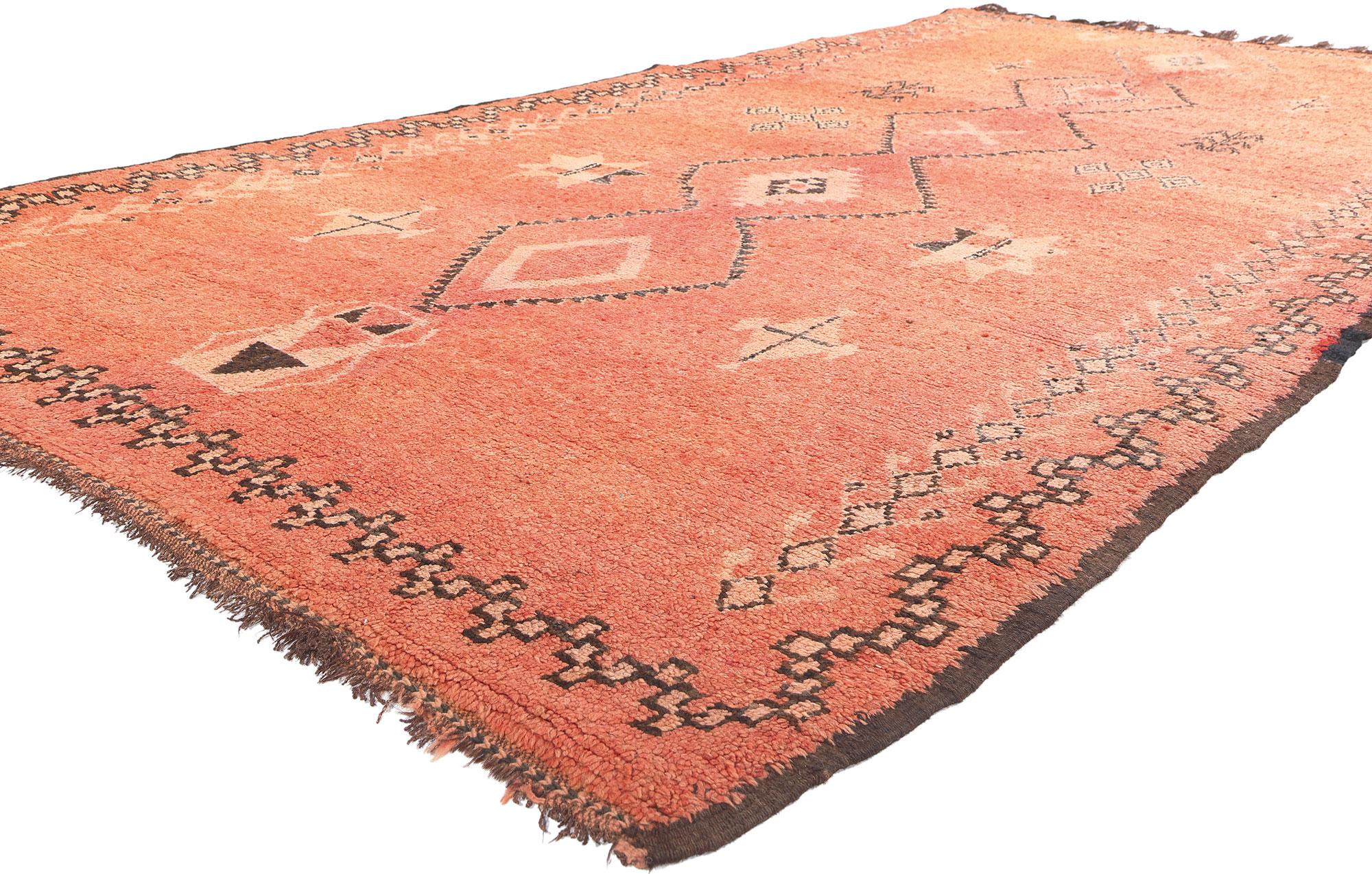 20323 Vintage Orange Taznakht Moroccan Rug, 05'11 x 11'08.
Embark on a journey into the rich legacy of the Taznakht Tribe, where skilled hands in the High Atlas Mountains of southern Morocco wove this hand-knotted wool vintage Berber Moroccan rug—an