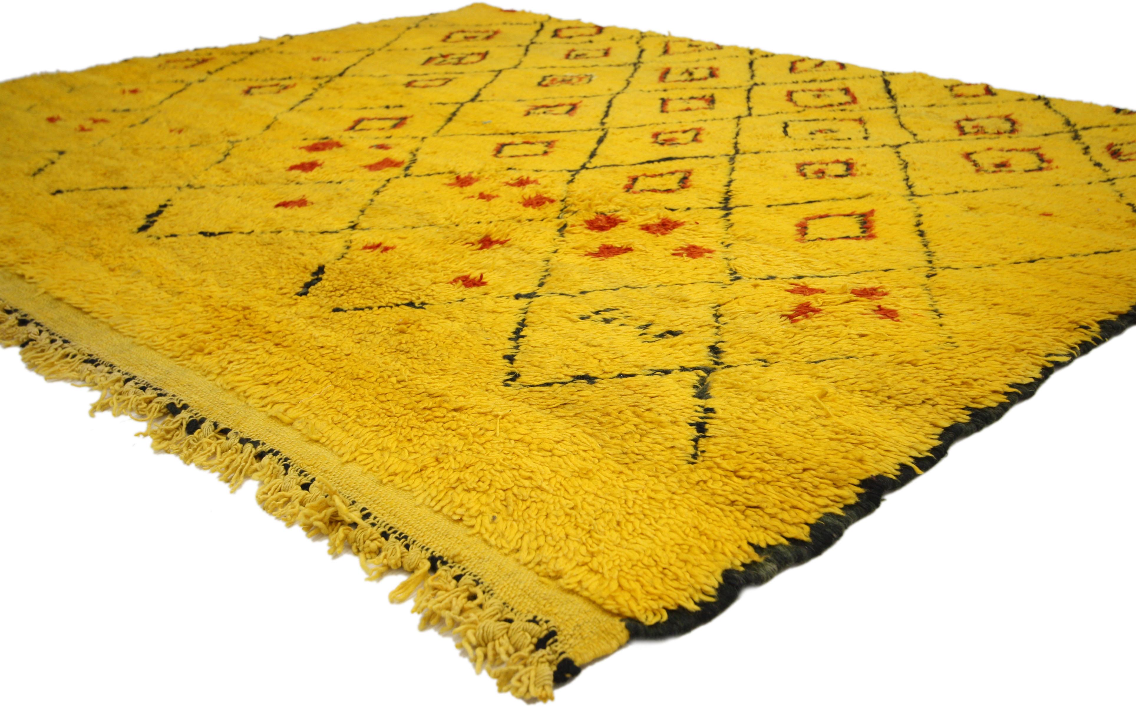 74779, vintage Berber Moroccan rug with tribal style. This vintage Berber Moroccan rug incorporates golden yellow, red, orange and black-brown to create a variegated yet harmonious design pattern that is woven throughout the rug. The primary