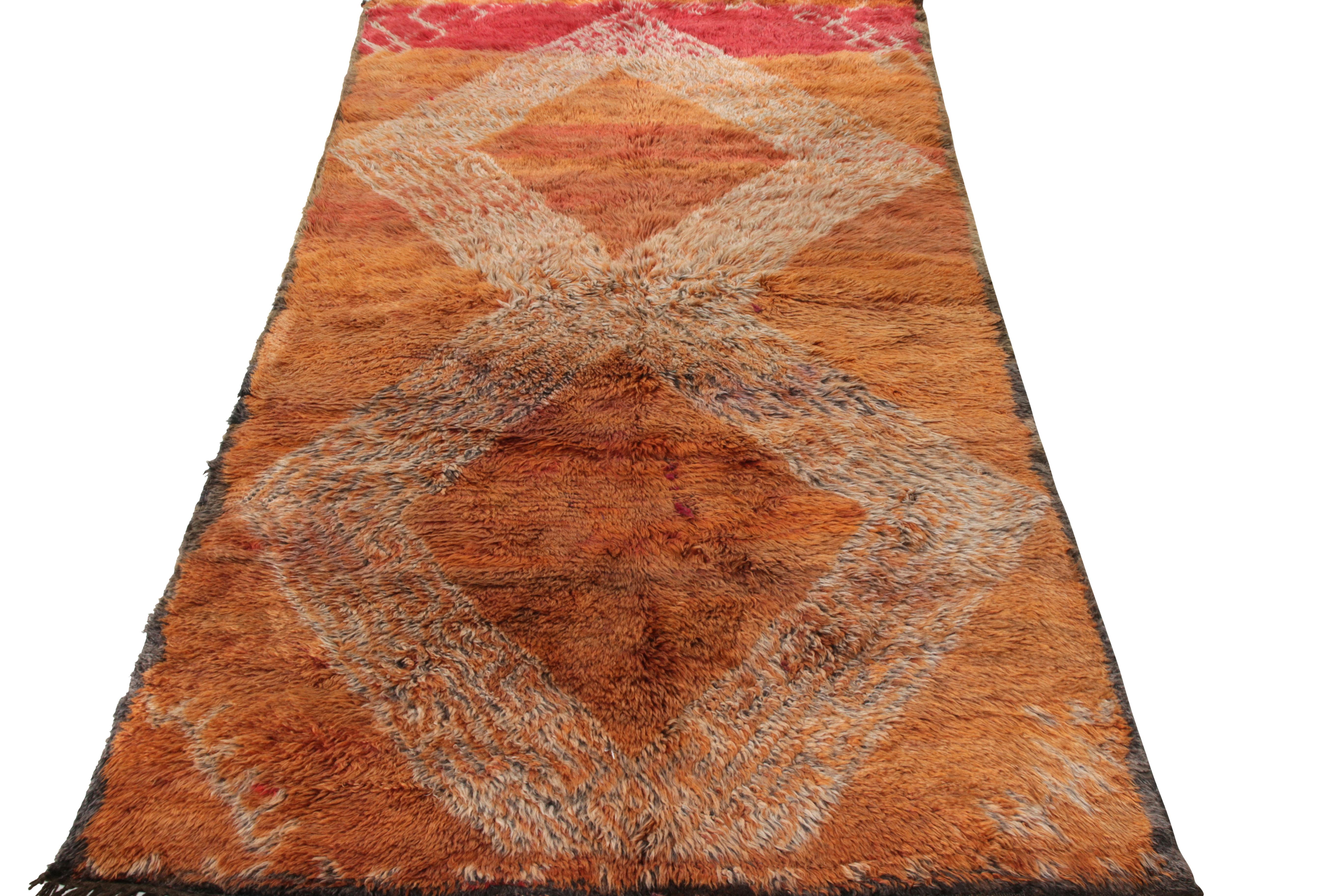 Hand knotted in wool, a 5x10 Berber runner joining Rug & Kilim’s diverse Moroccan rug collection. Originating from Morocco circa 1950-1960, this tribal style rug in a shag/high pile textura features a well defined geometric pattern with open field