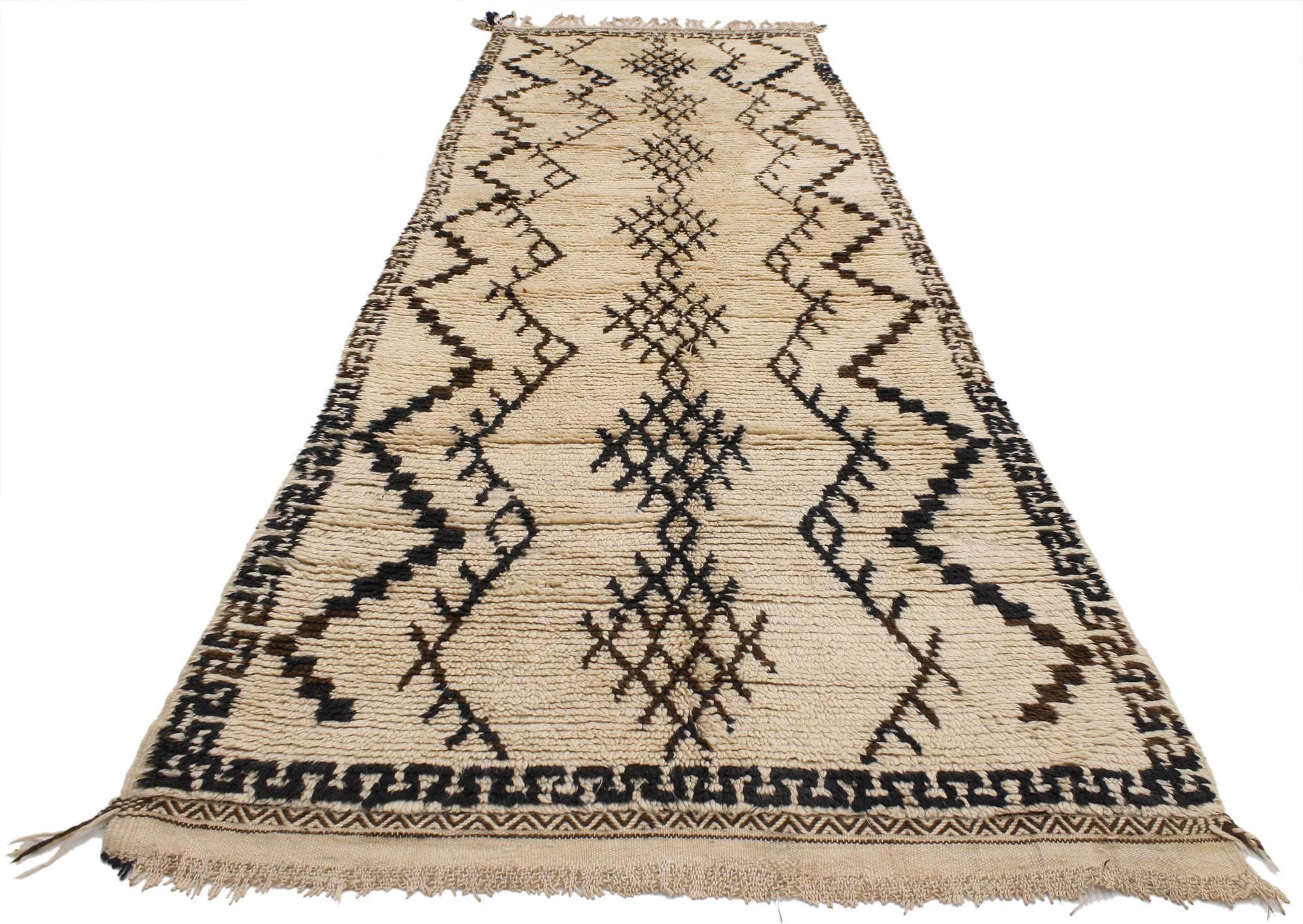 20565, vintage Berber Moroccan rug runner. A muted tone of creamy-beige provides a beautiful backdrop for the espresso, chocolate and black colored designs that overlay this Vintage Berber Moroccan rug. With its tribal style, texture and warmth, the