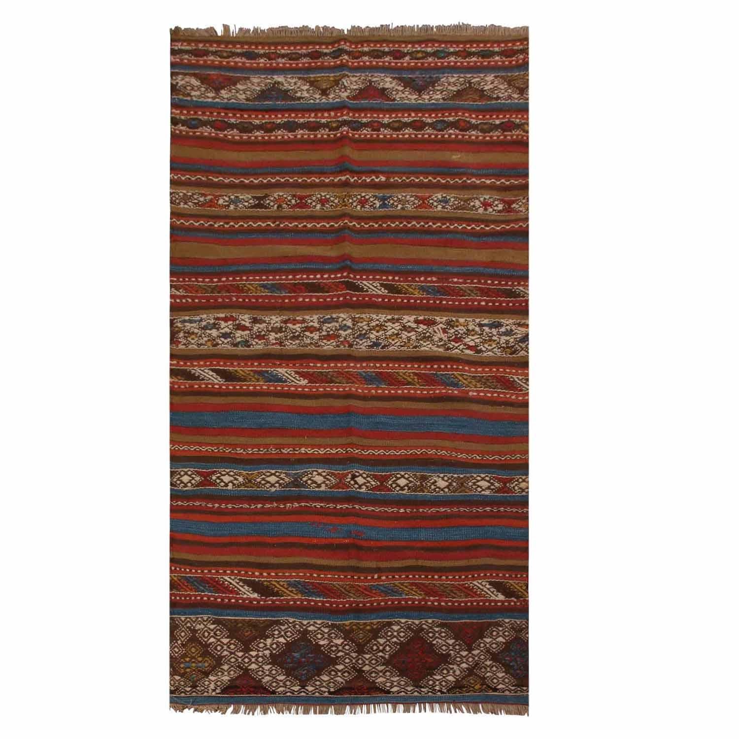 Flat-woven in high-quality wool originating from Turkey between 1940-1945, this vintage Konya Kilim rug enjoys an interesting departure from traditionally mirrored borders and a further intriguing pallet of vibrant rich and pastel colorways