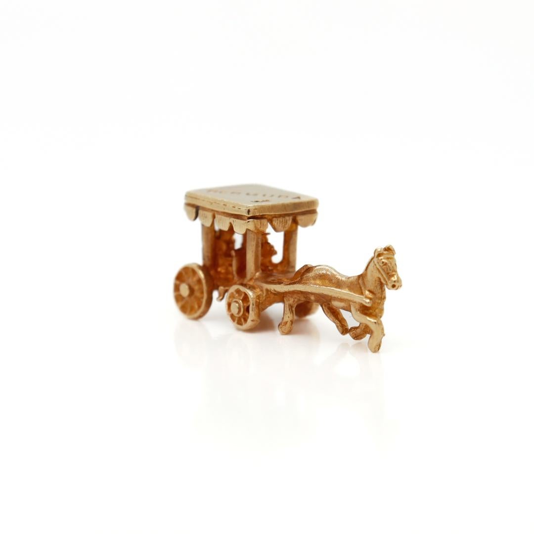 A fine vintage charm.

In 10k yellow gold.

In the form of a horse drawn carriage.

Marked to the roof of the carriage: Bermuda and 10k.

Simply a wonderful charm for a bracelet!

Date:
20th Century

Overall Condition:
It is in overall good,