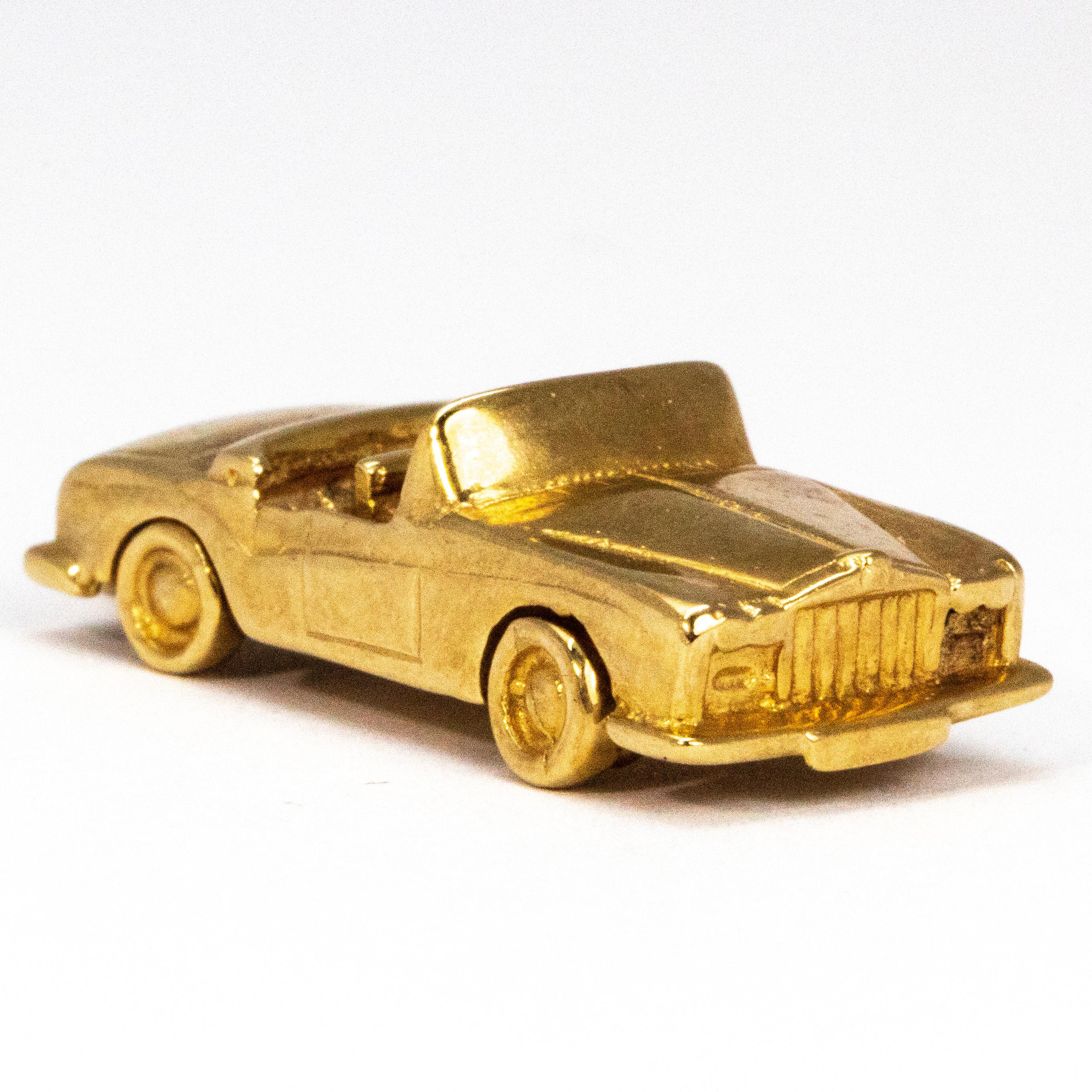 This sweet charm is modelled on a Rolls Royce car and is made out of 9ct gold. The maker, Bernard Instone, is a collectable name. 

Car Dimensions: 28mm x 12.5mm 