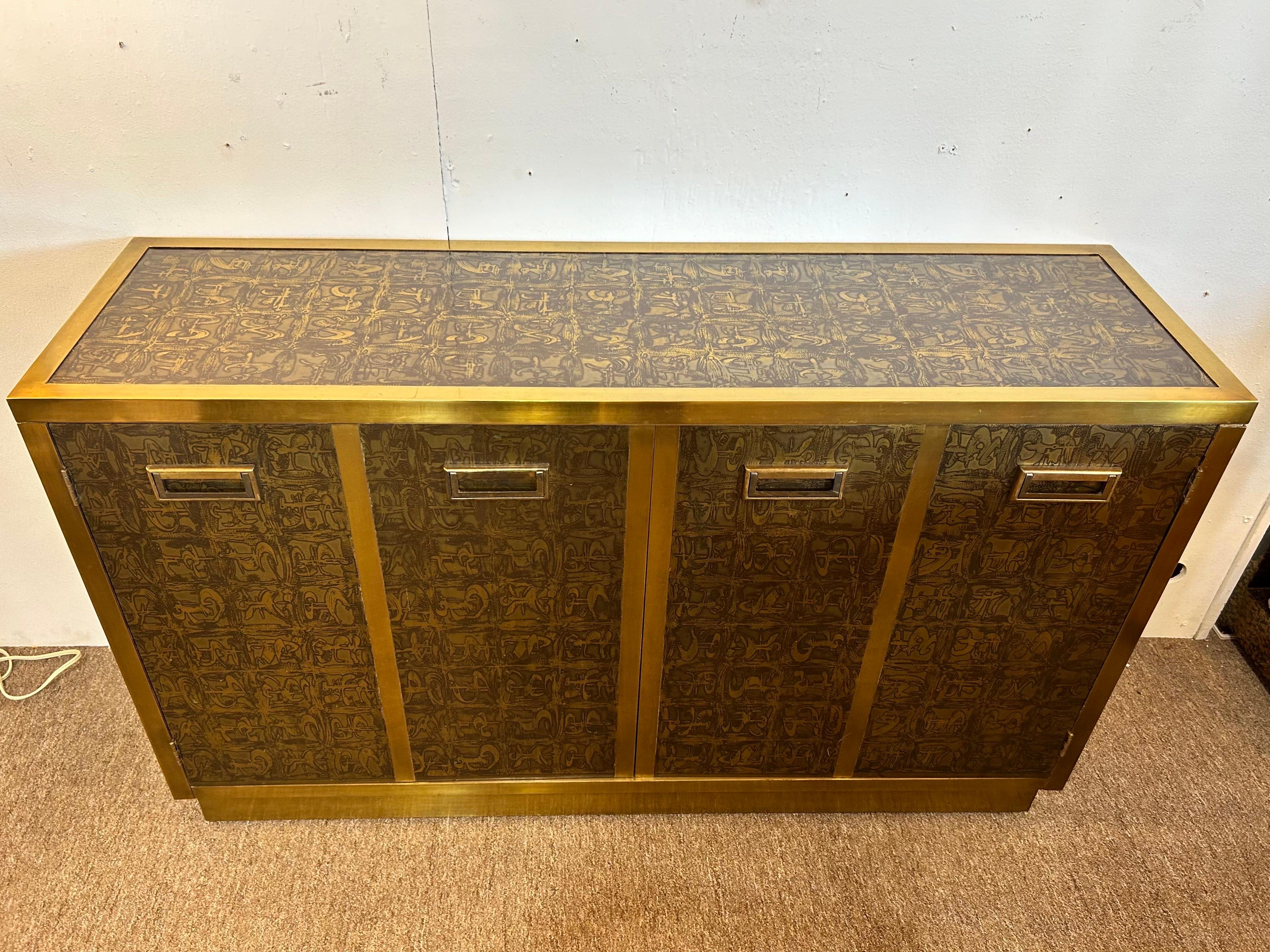 A vintage 1970's Bernhard Rohne designed acid etched two door cabinet for Mastercraft. The acid etched finish is visible on four sides - the top, front, left and right. The back is painted in a golden color. This piece features two doors on the