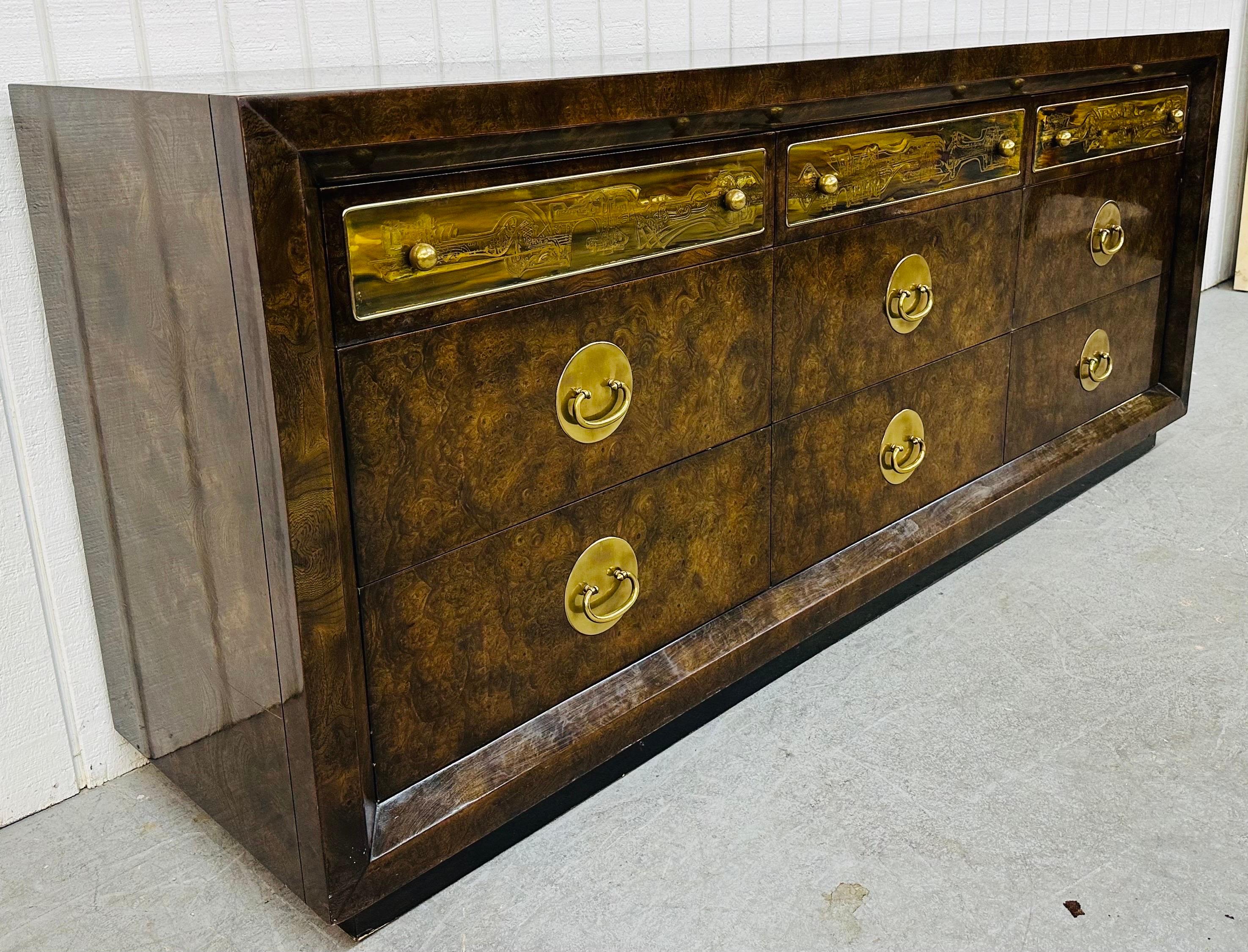 This listing is for a Vintage Bernhard Rohne for Mastercraft Burled Wood Dresser. Featuring a straight line design, plinth base, nine drawers for storage, beautiful decorative brass plates on the top drawers, original brass pulls on the