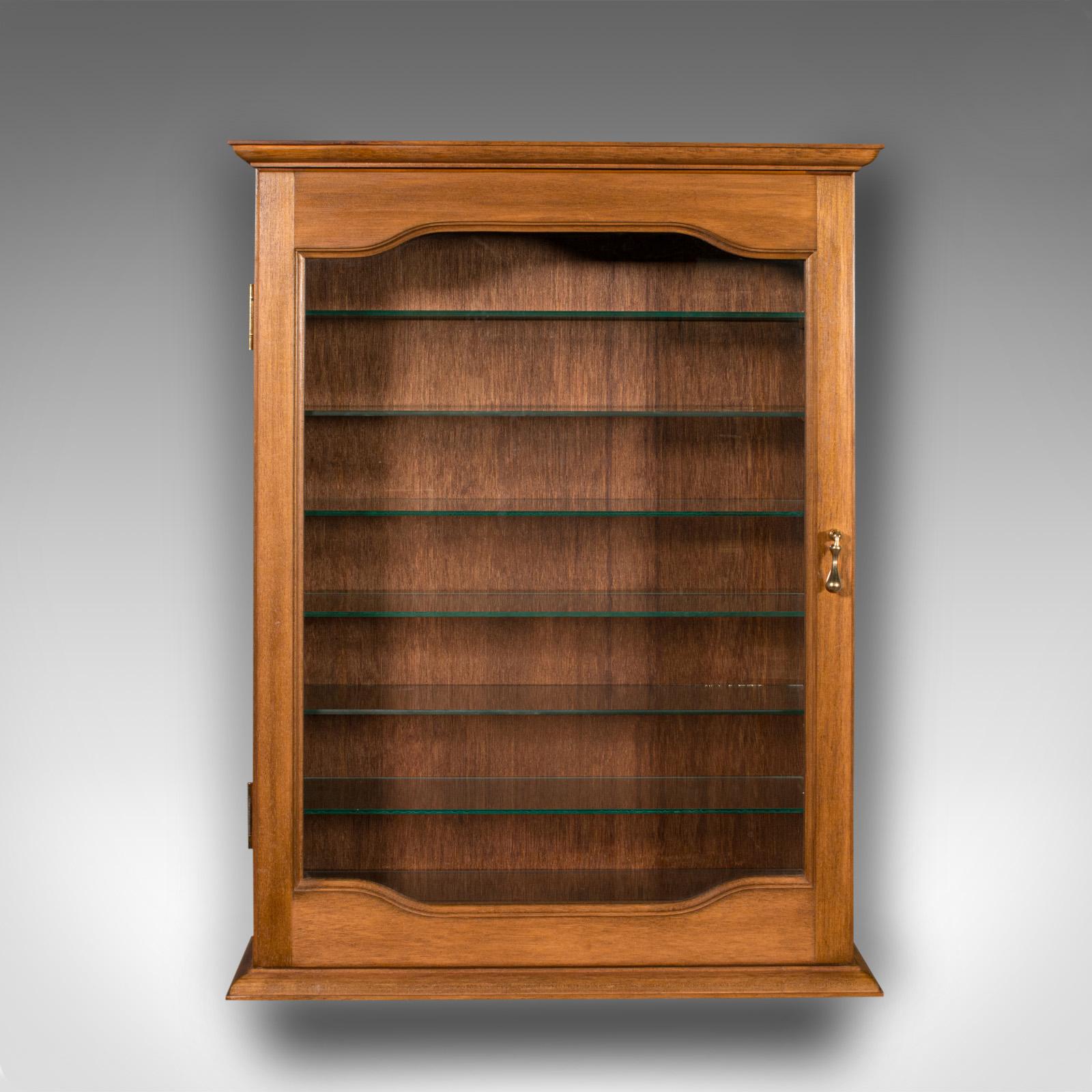 This is a vintage bespoke display cabinet. An English, mahogany and glass retail or collector's shelf cupboard, dating to the late 20th century.

Beautifully glazed and of high quality - superb for the Dinky collector or other small items
Displaying