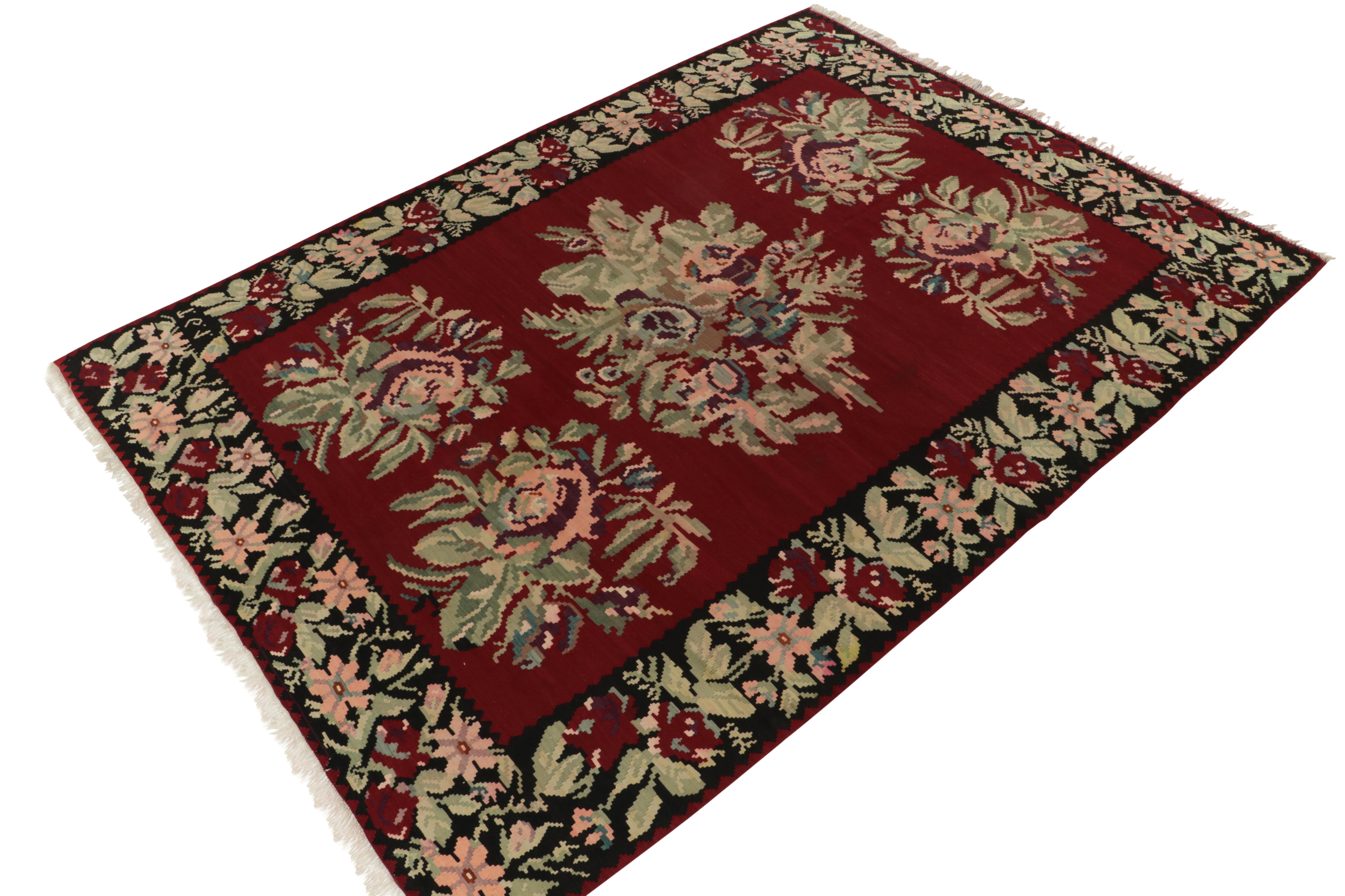 Handwoven in wool circa 1950-1960, a rare 9x12 vintage Kilim believed to be of Bessarabian provenance. 

On the Design: This grand work seems to exemplify those of its lineage while subtly innovating the style to a keen eye. The rich red plays